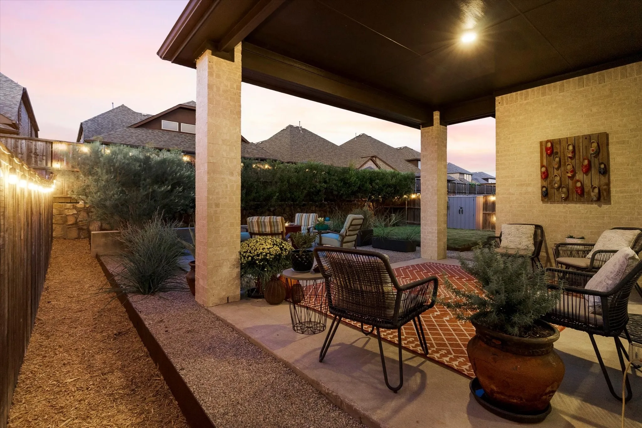 Covered patio with recessed lighting, concrete flooring, and a brick exterior wall