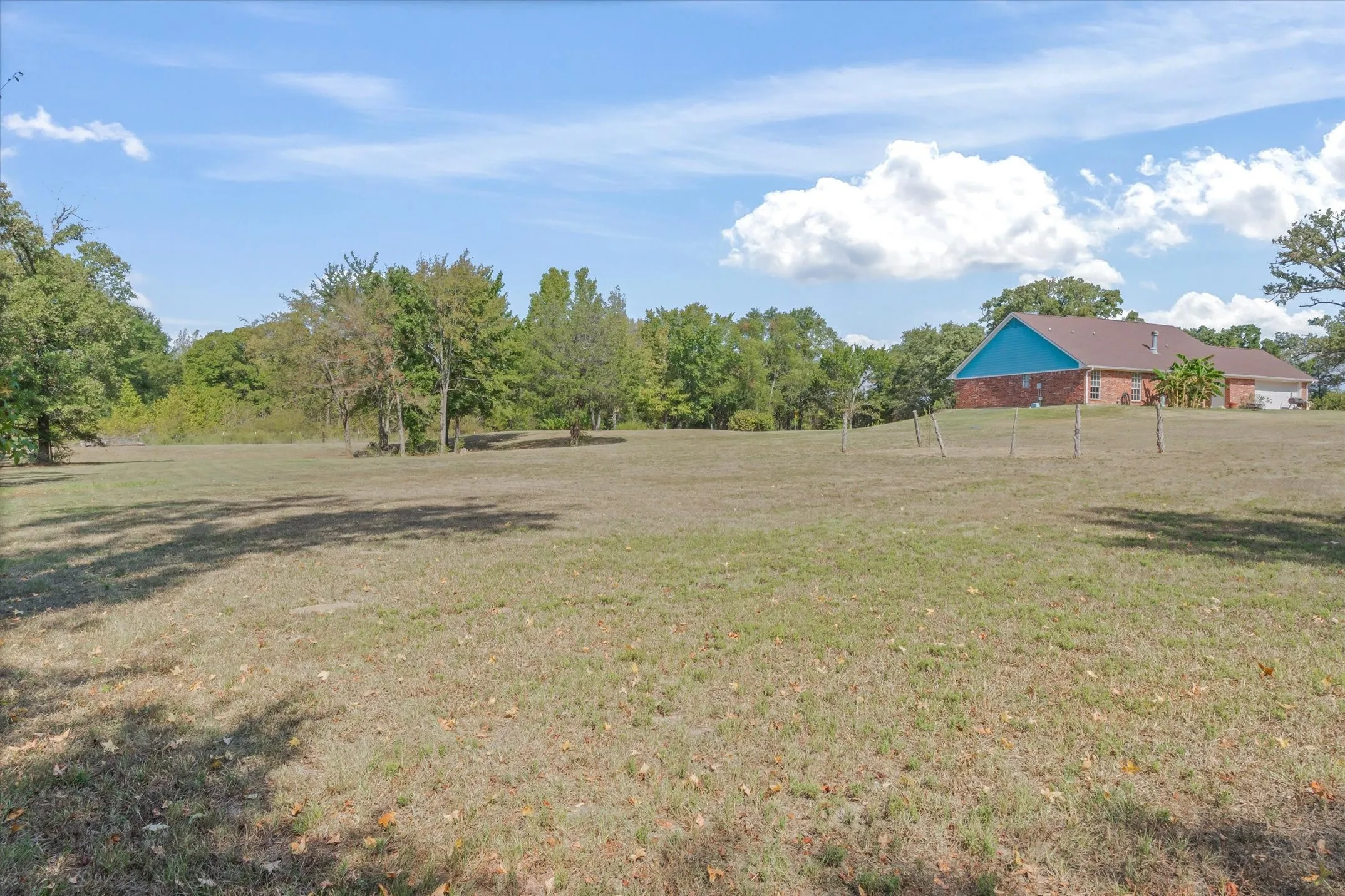 from the side of the woods looking towards the home