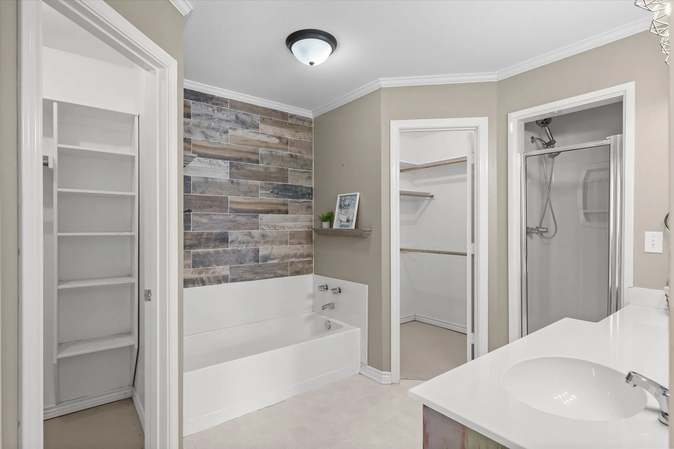 Ensuite primary bathroom with sep tub and sep shower