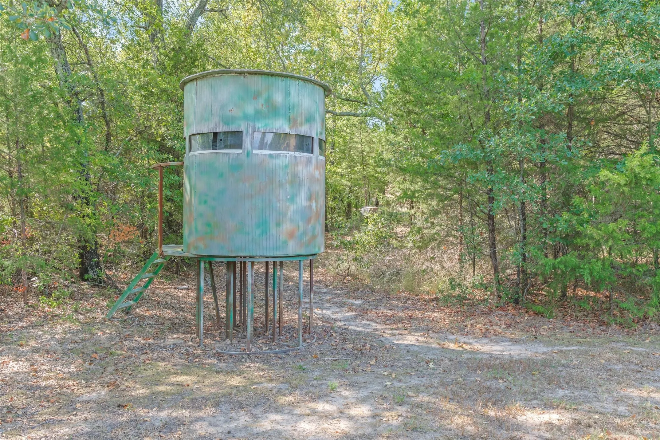 This property offers woods, a creek and a pond