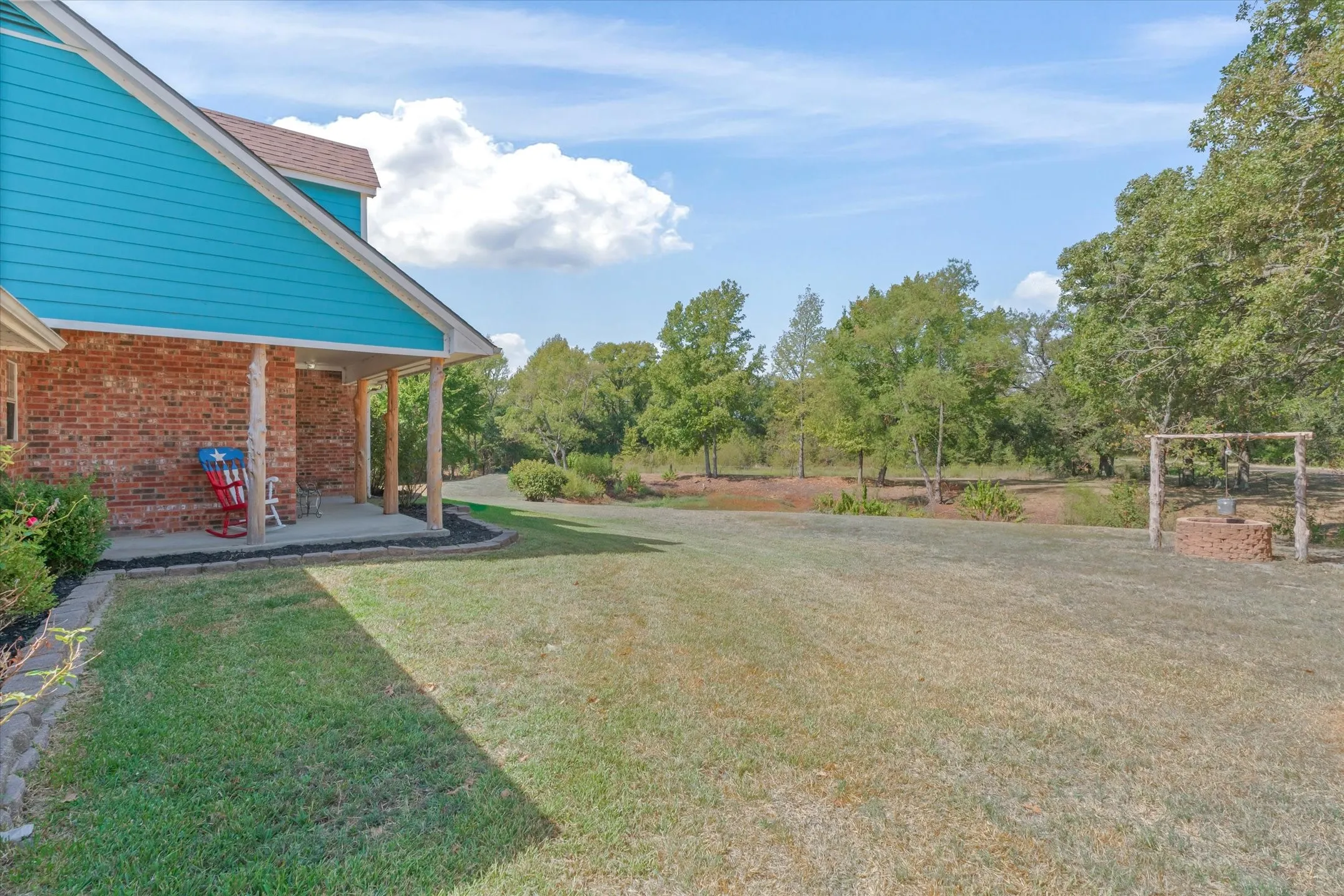 The porch wraps around for many beautiful east TX views
