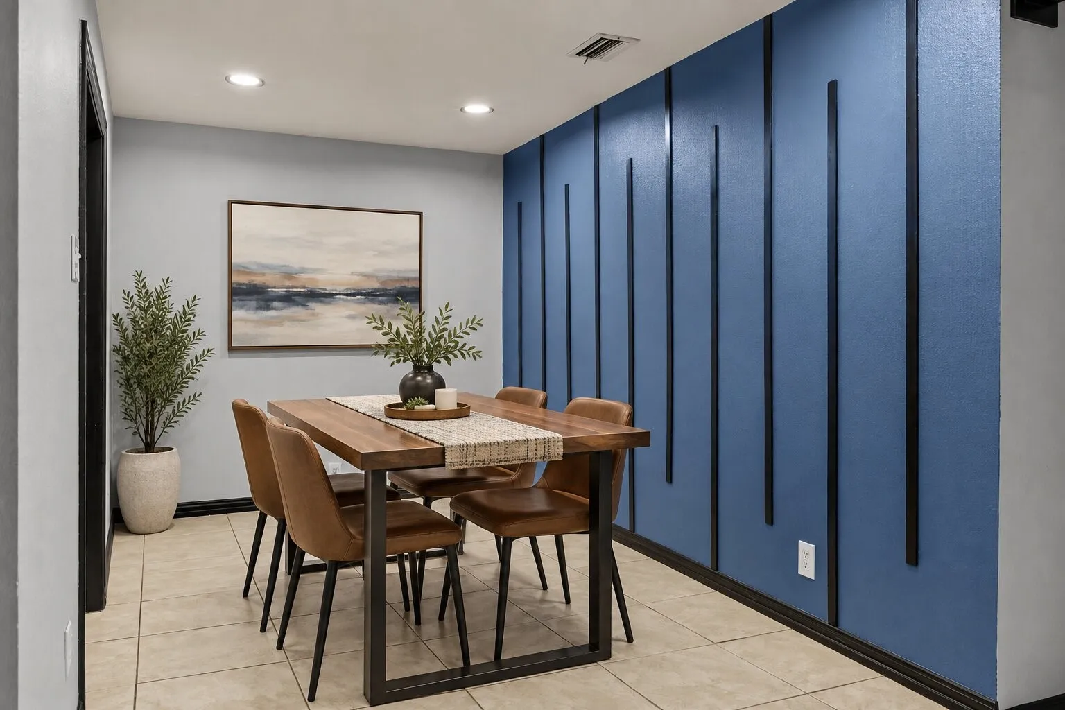 Decorative accent wall with vertical trim, recessed lighting, and tile flooring