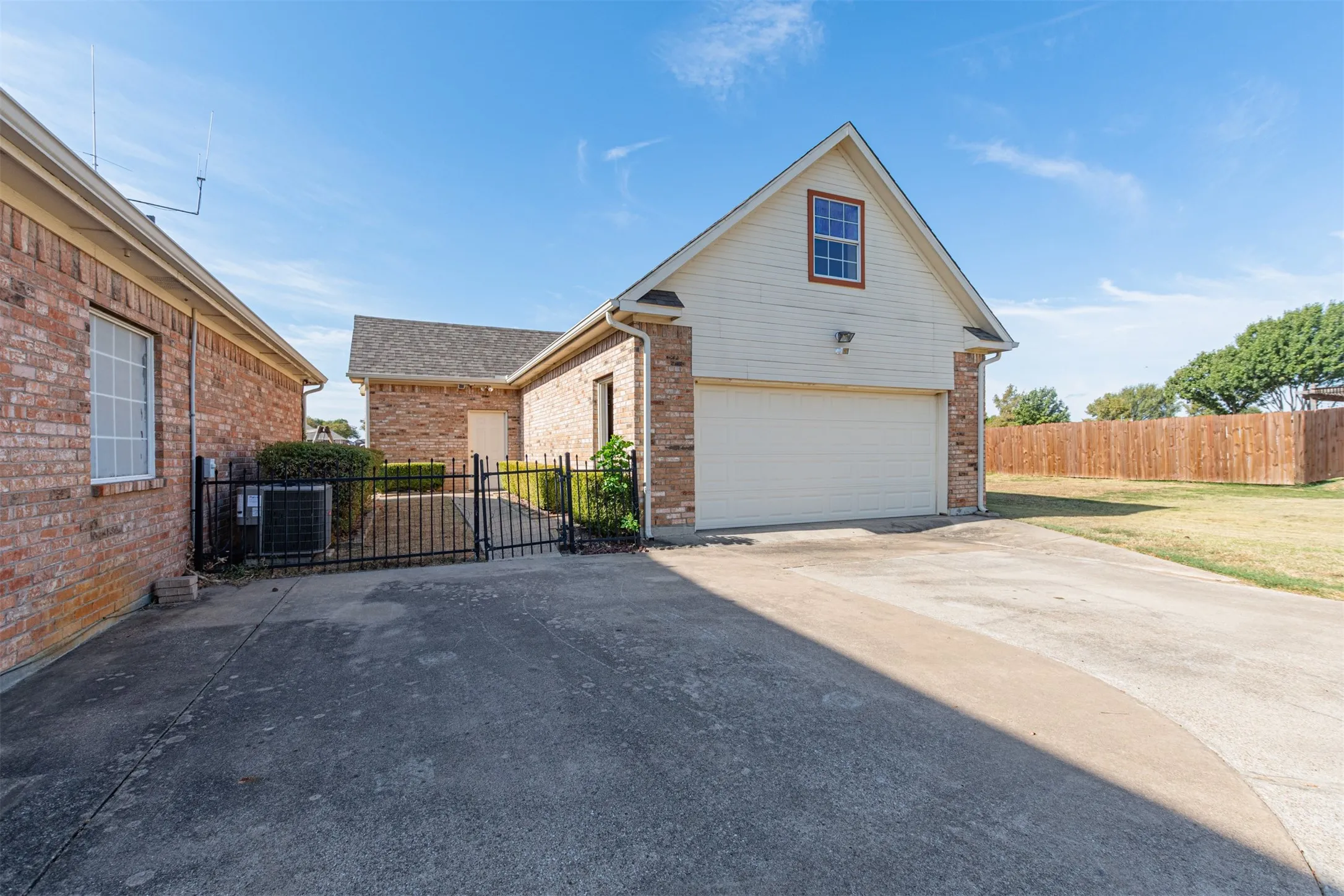 Detached building with office, 1/2 bath, room for 4 cars, & upstairs storage