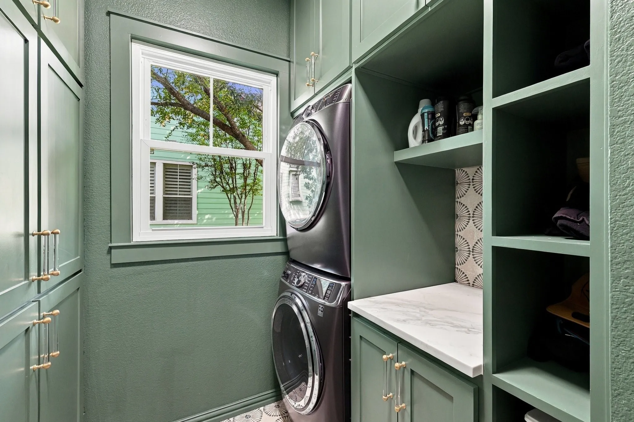 Reimagined laundry space with folding table and lots of storage built in