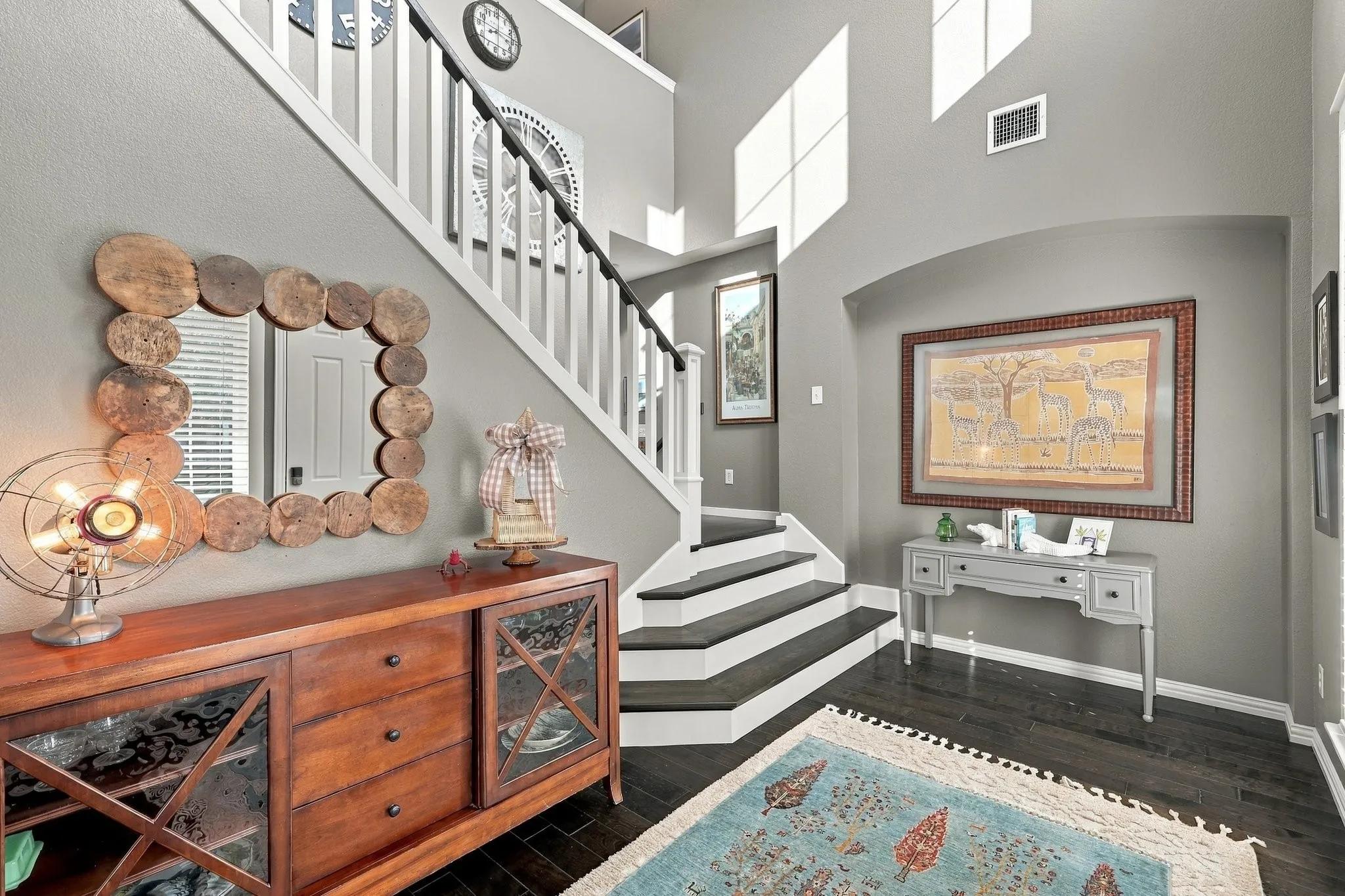 Sweeping staircase in gracious entry hall