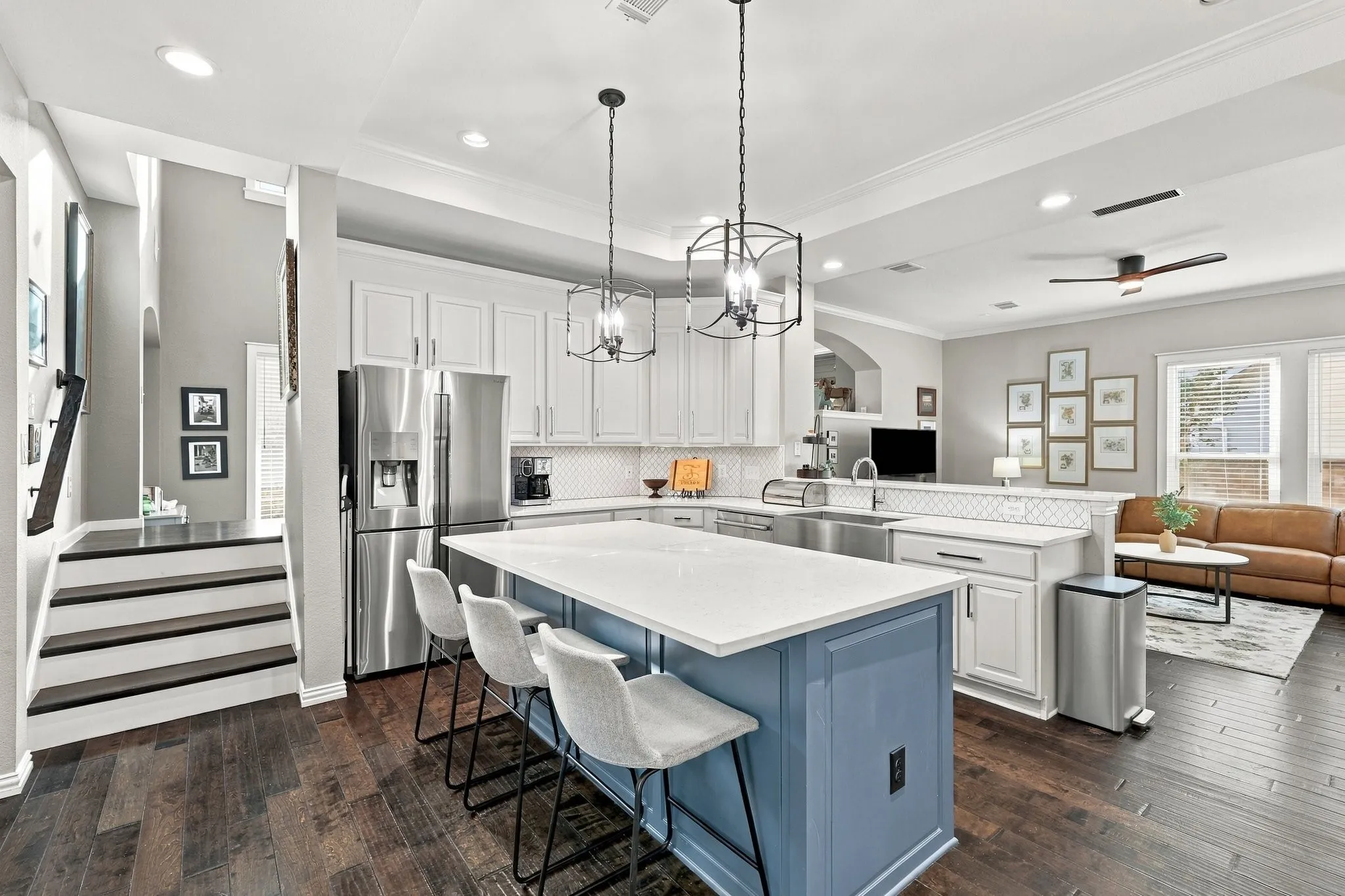 Spacious kitchen with stairs leading to main staircase