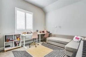 Window featuring white plantation shutters and light gray walls