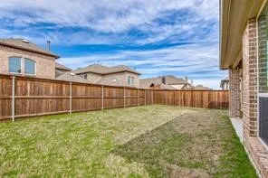 Expansive lawn with a full privacy fence