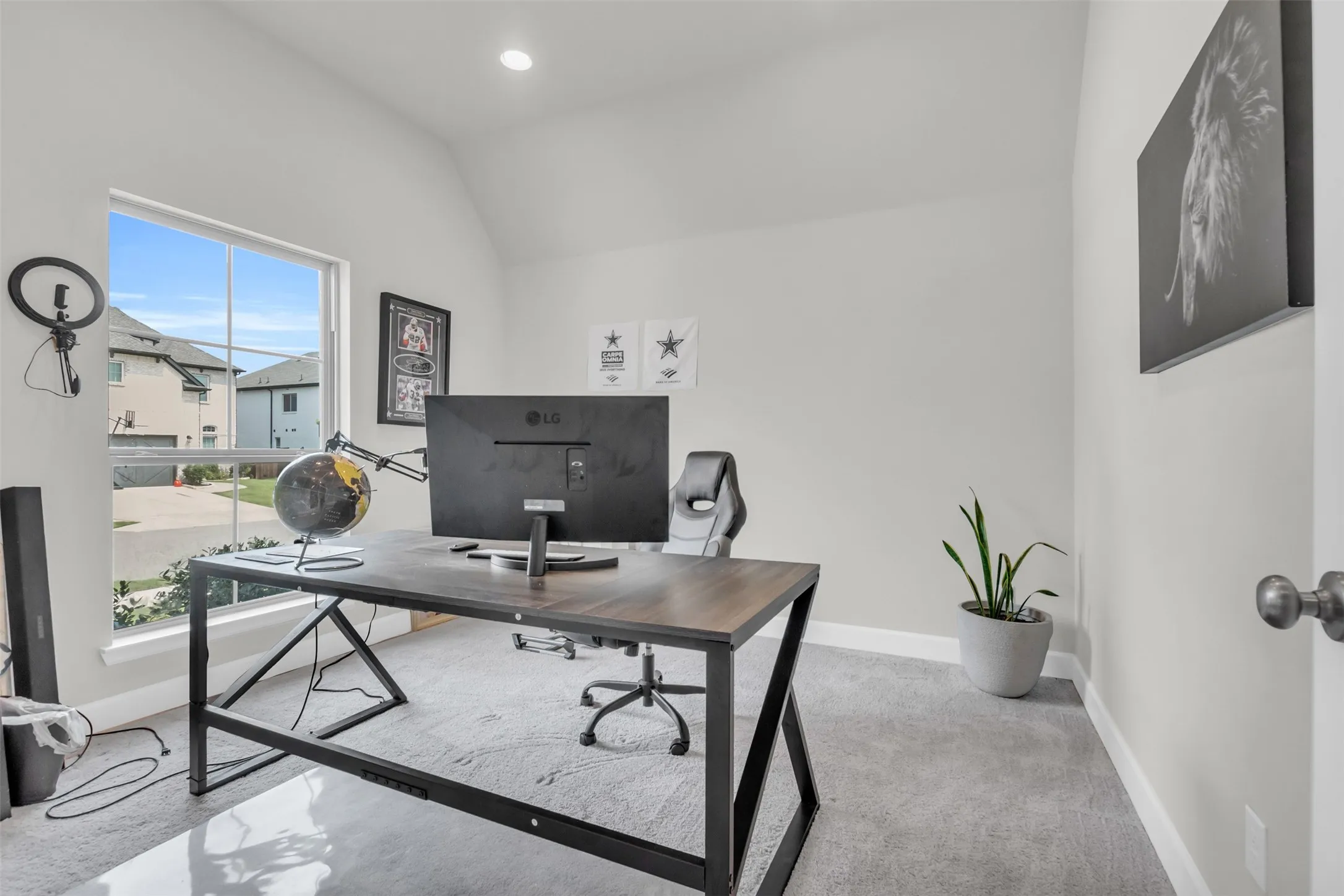 Office area featuring light colored carpet, vaulted ceiling, and recessed lighting