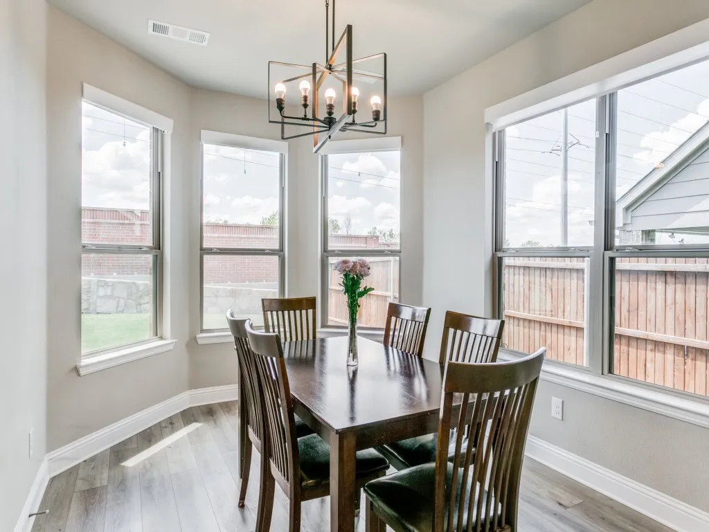 Sun filled breakfast nook nestled off the kitchen