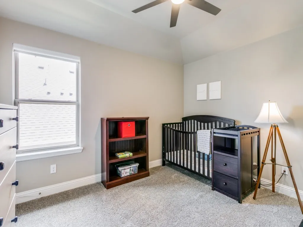 Another spacious bedroom upstairs with walk-in closet and access to walk-in attic space