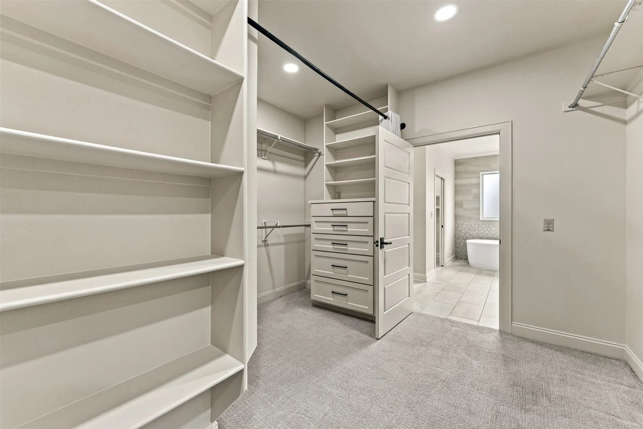 Oversized primary closet with plenty of space