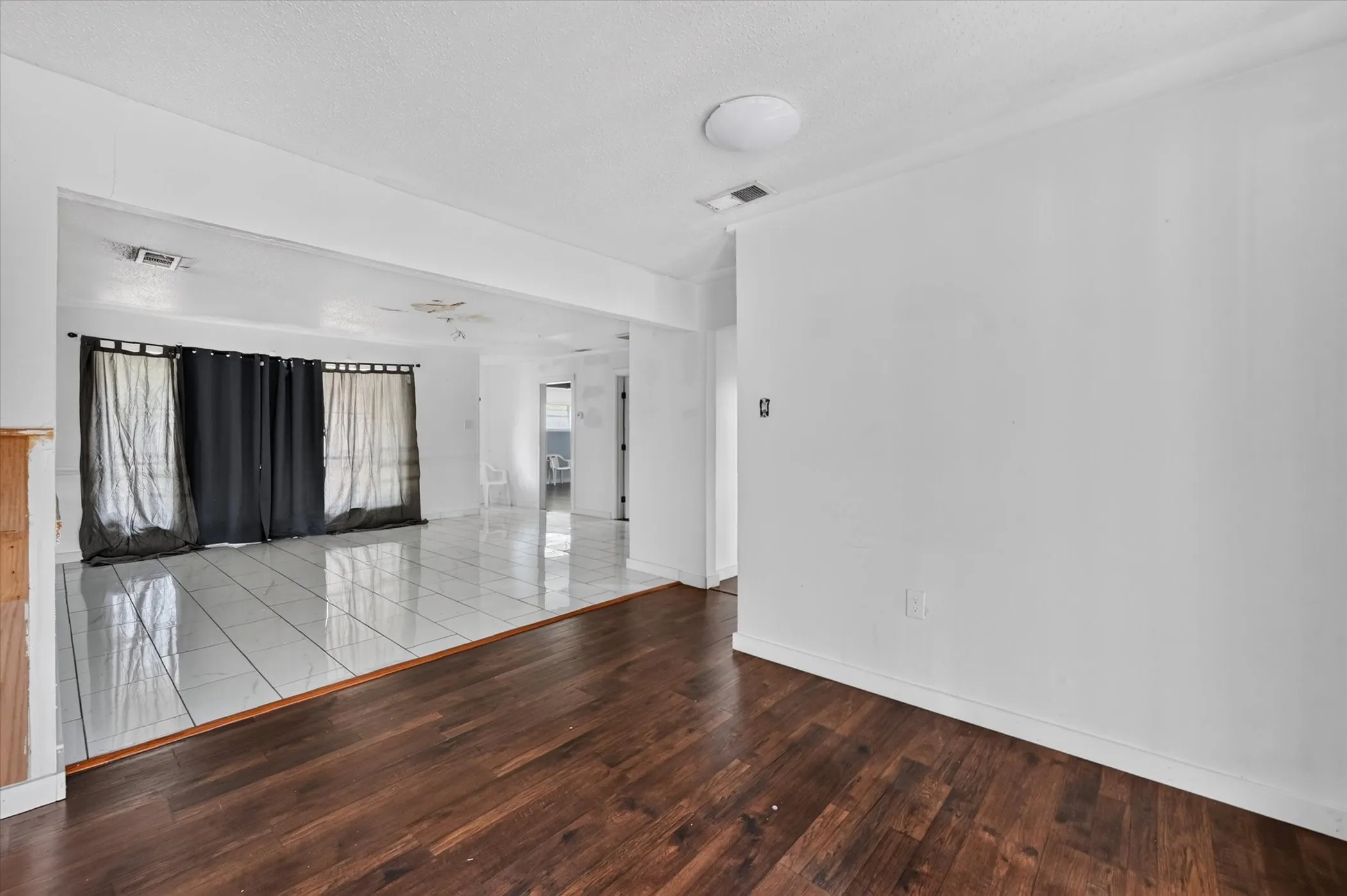 Wood-finish flooring with white wall finishes