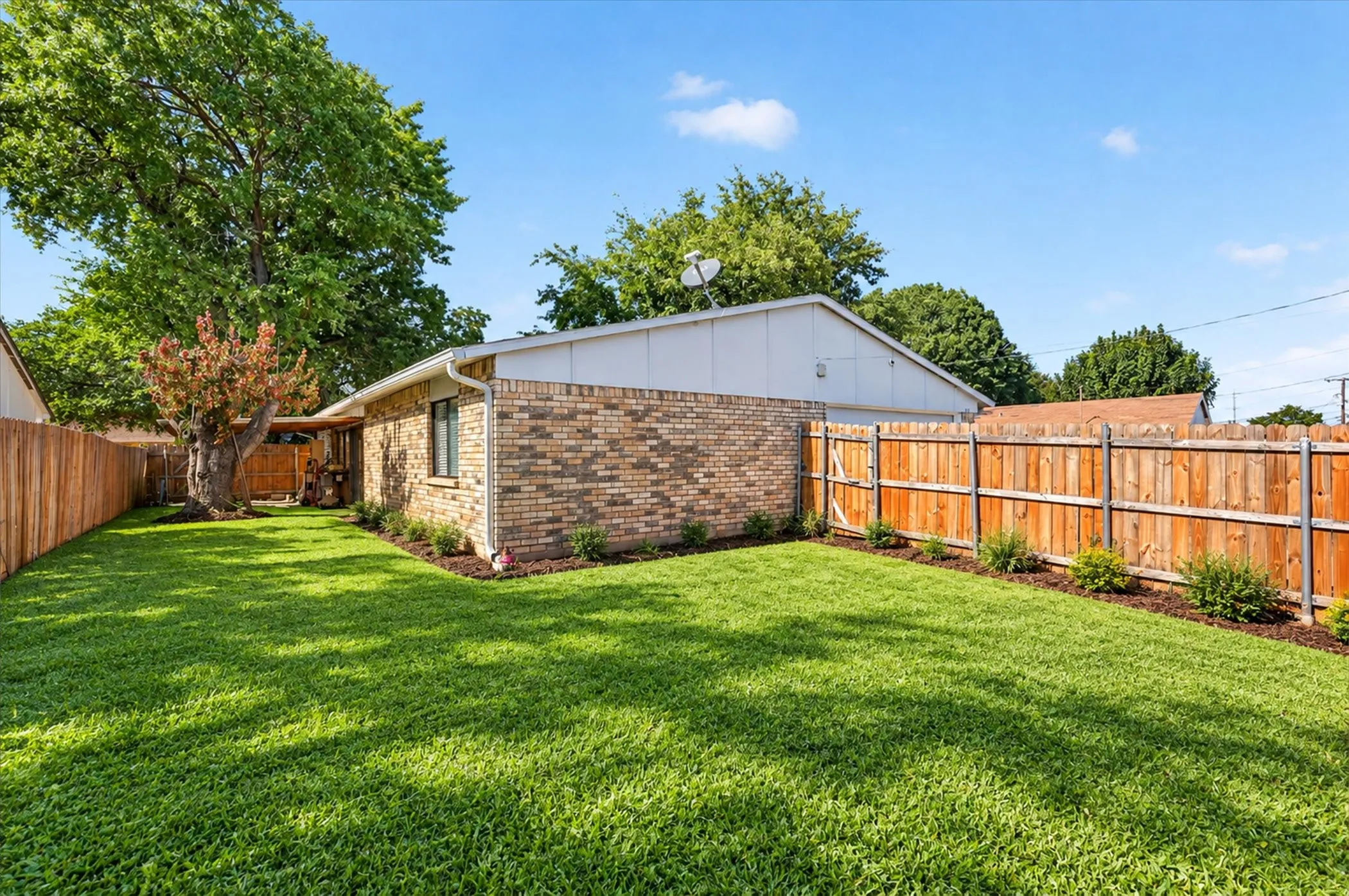 Backyard. Grass and landscaping is digitally altered.