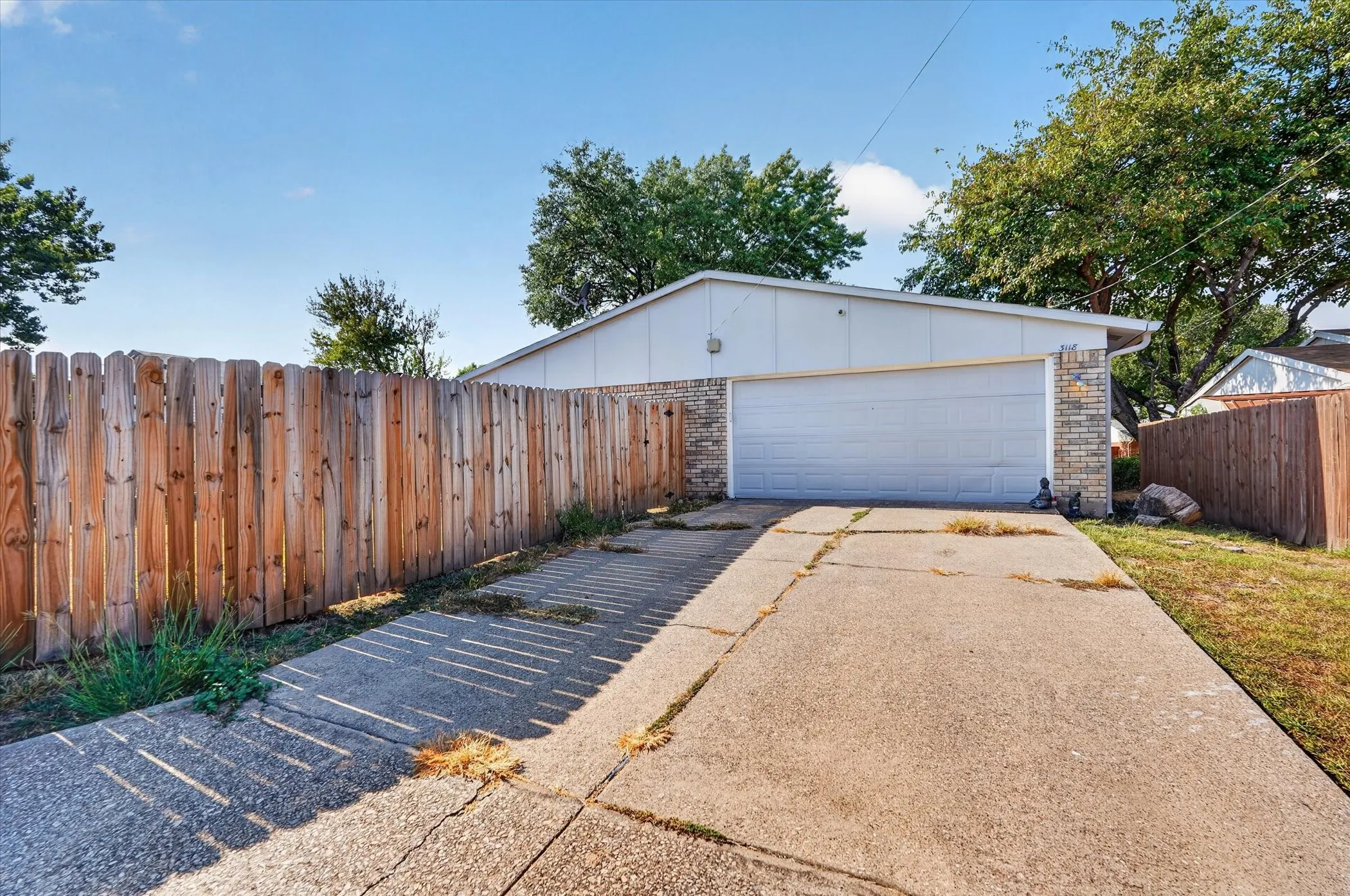 Attached two-car garage with a white garage door