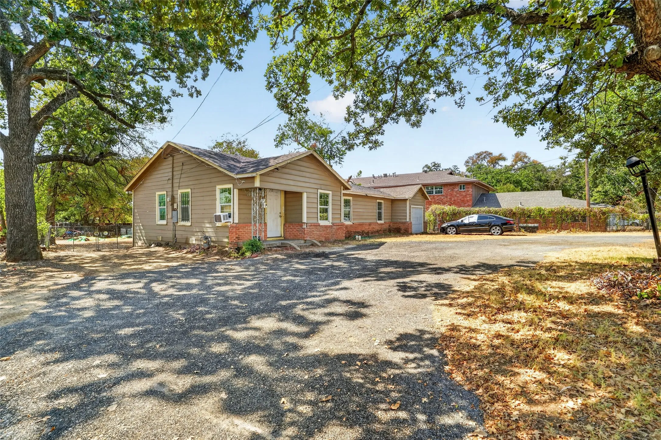 Single-story exterior with horizontal siding and brick accents