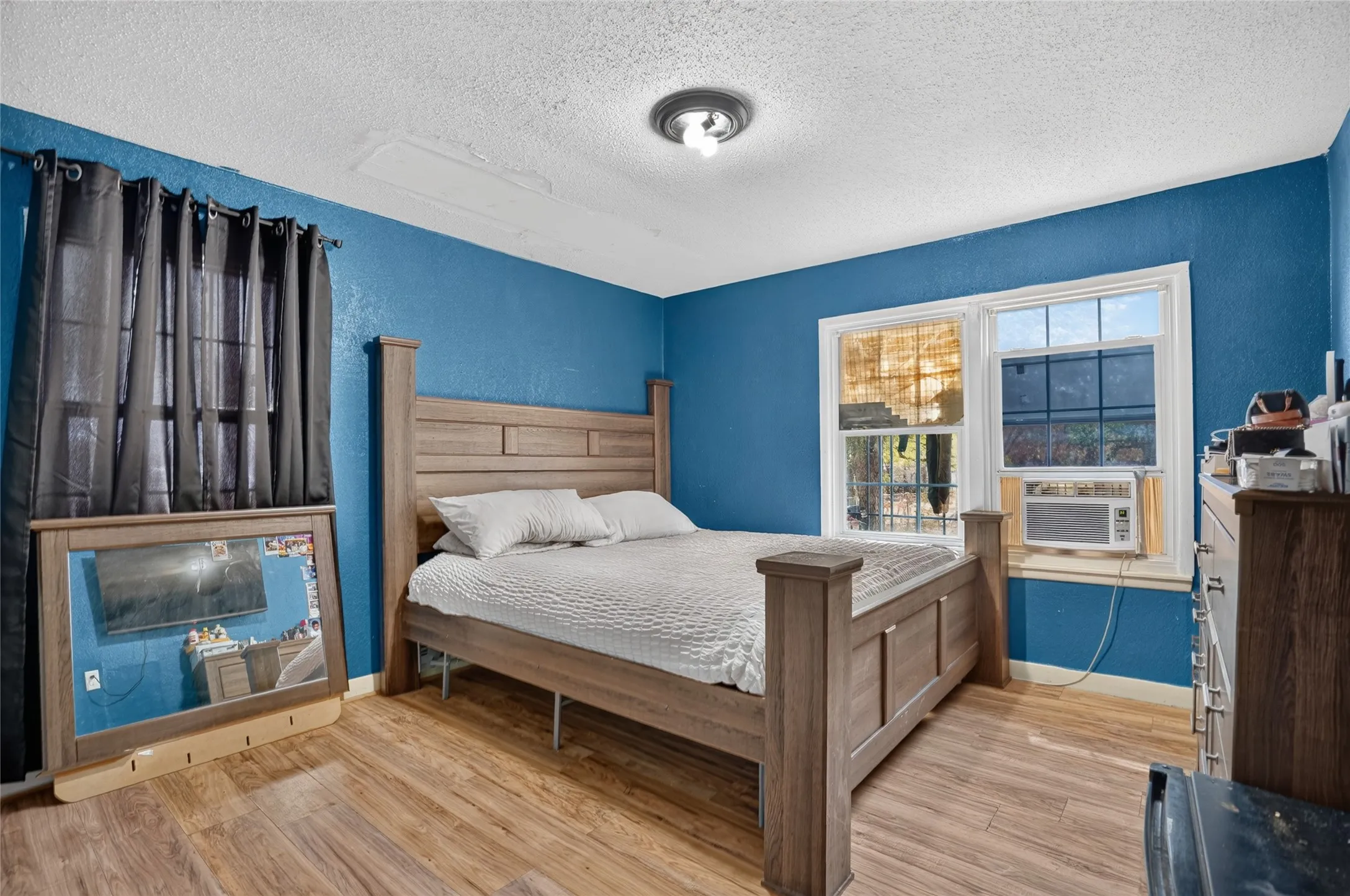 Wood-finish flooring with a textured wall finish