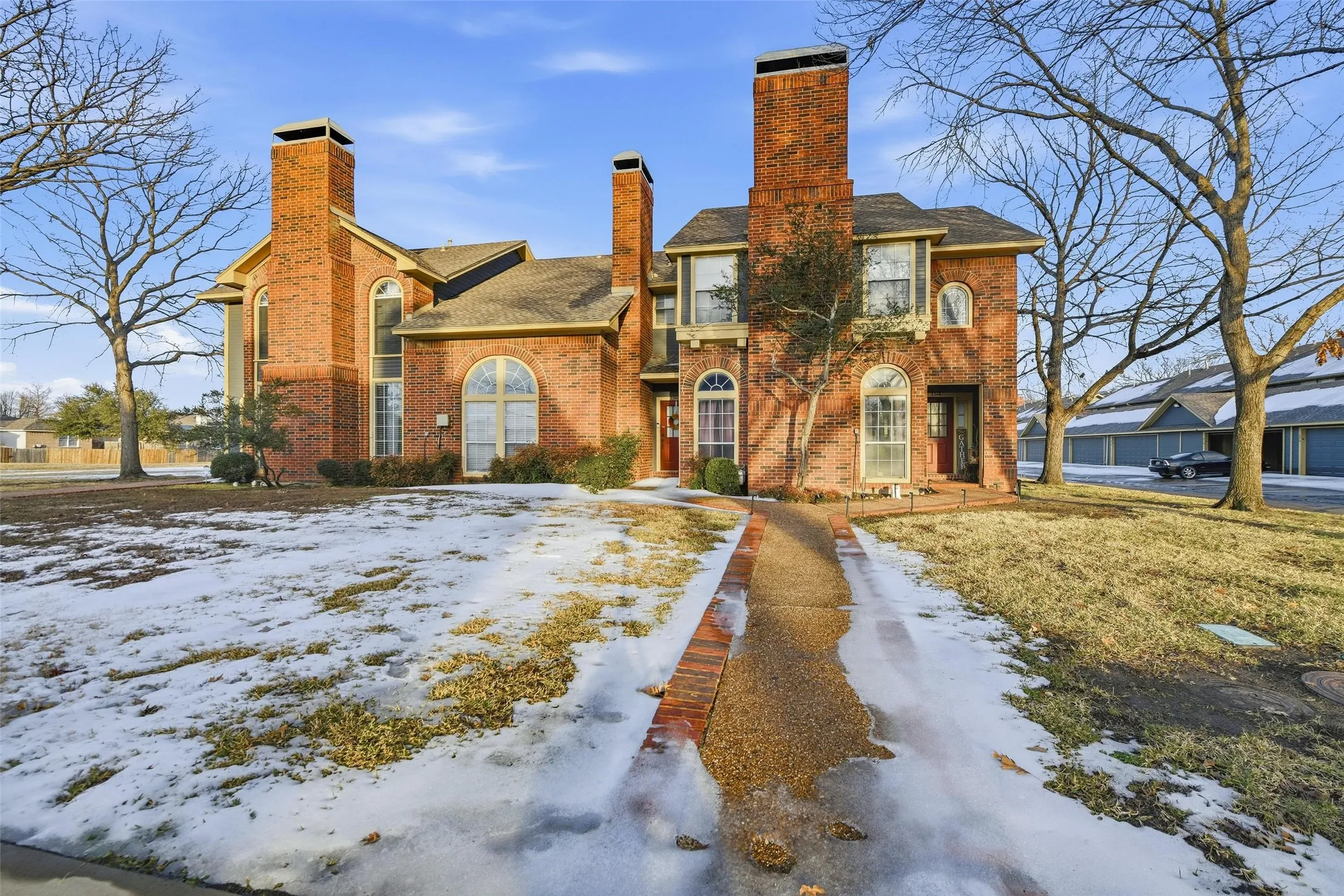 Brick exterior with multiple prominent chimneys