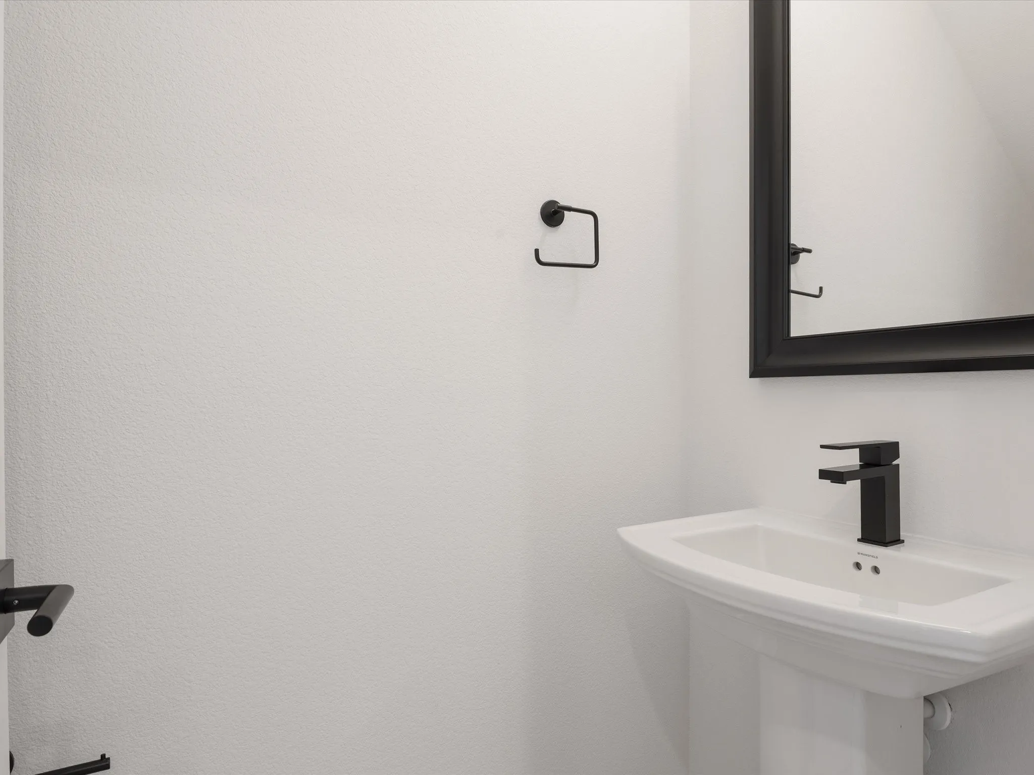 Powder Bath with pedestal sink and framed mirror
