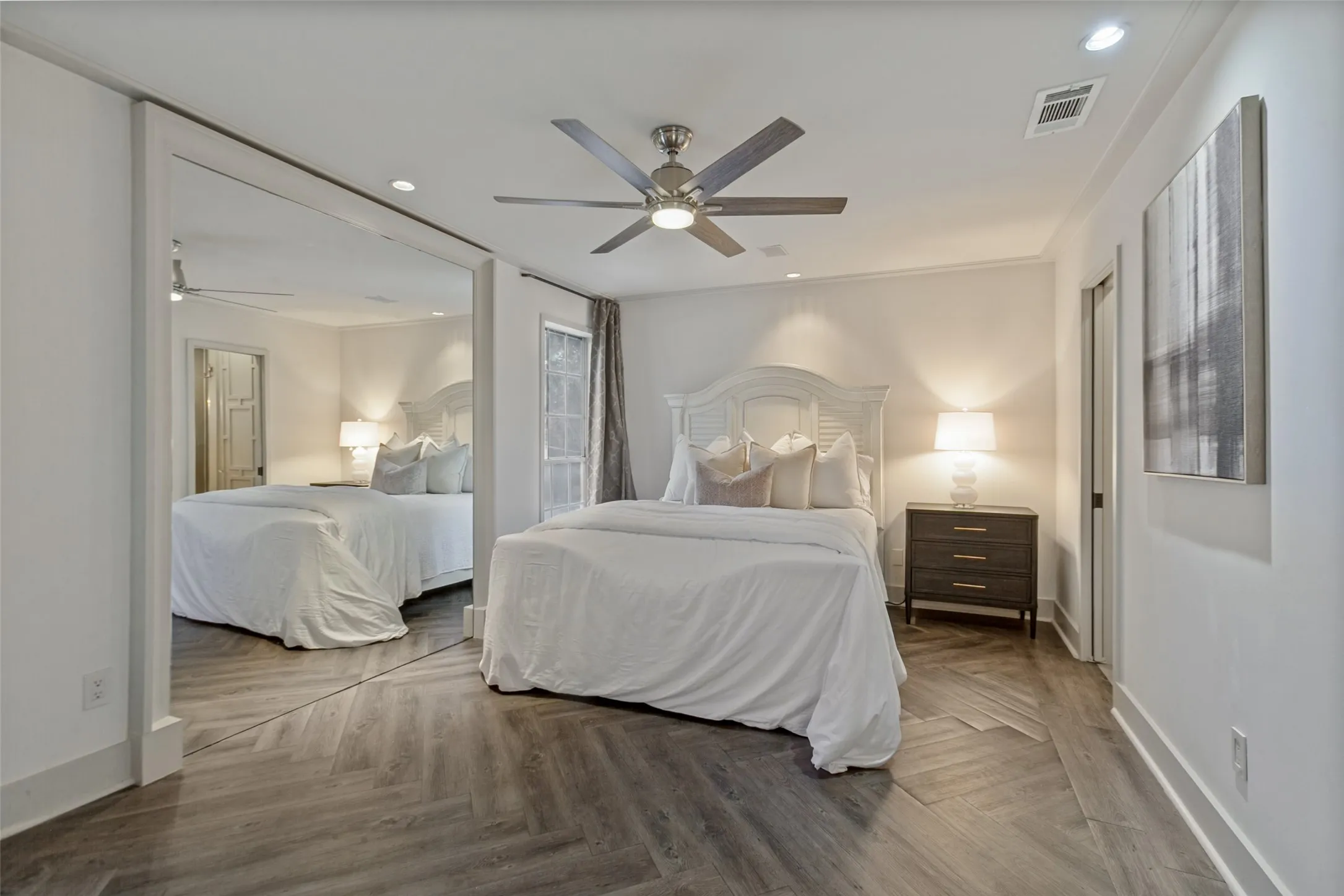 Primary bedroom with luxury vinyl plank flooring