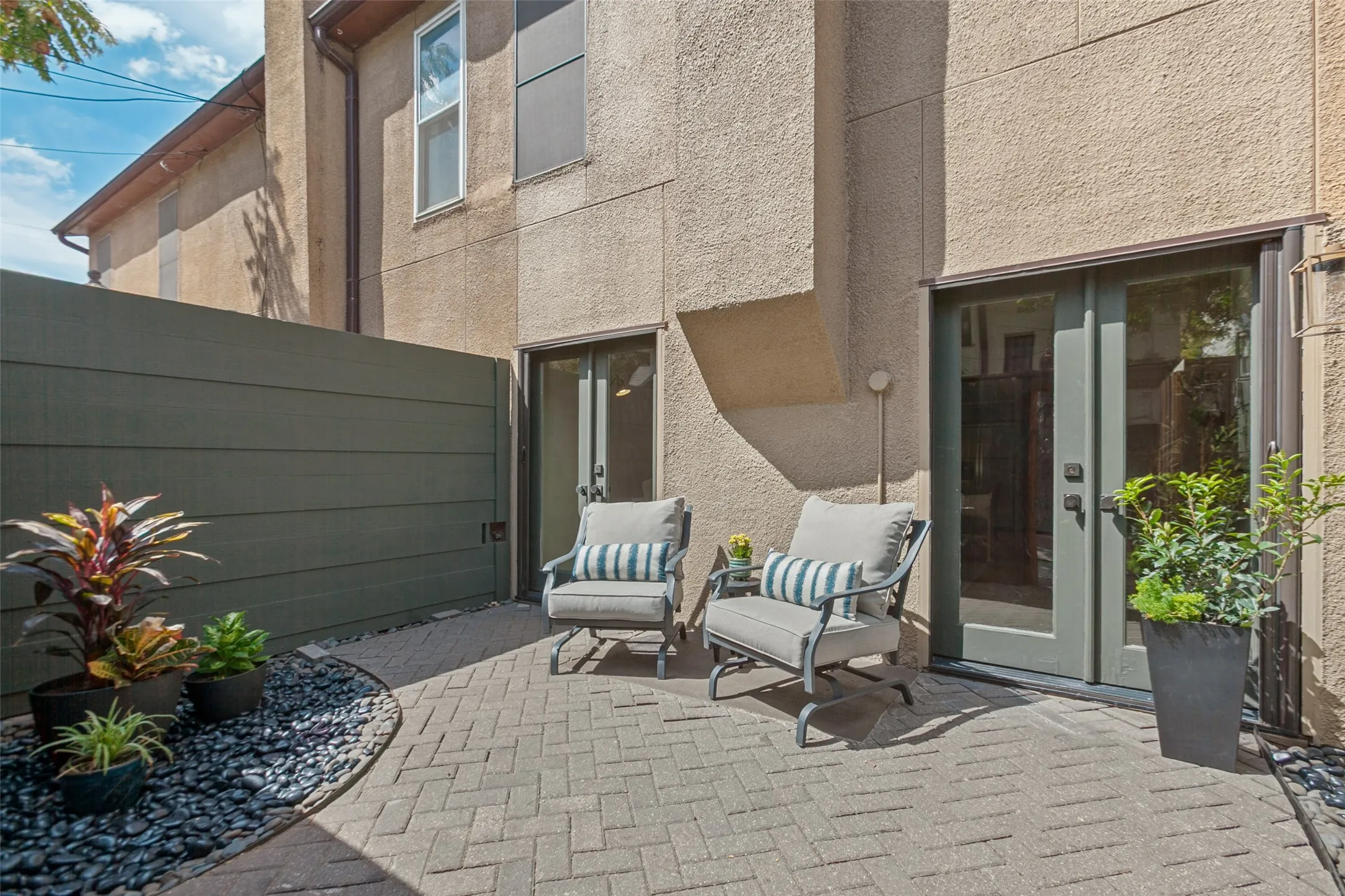 Privacy patio off living room- great space for entertaining or morning coffee