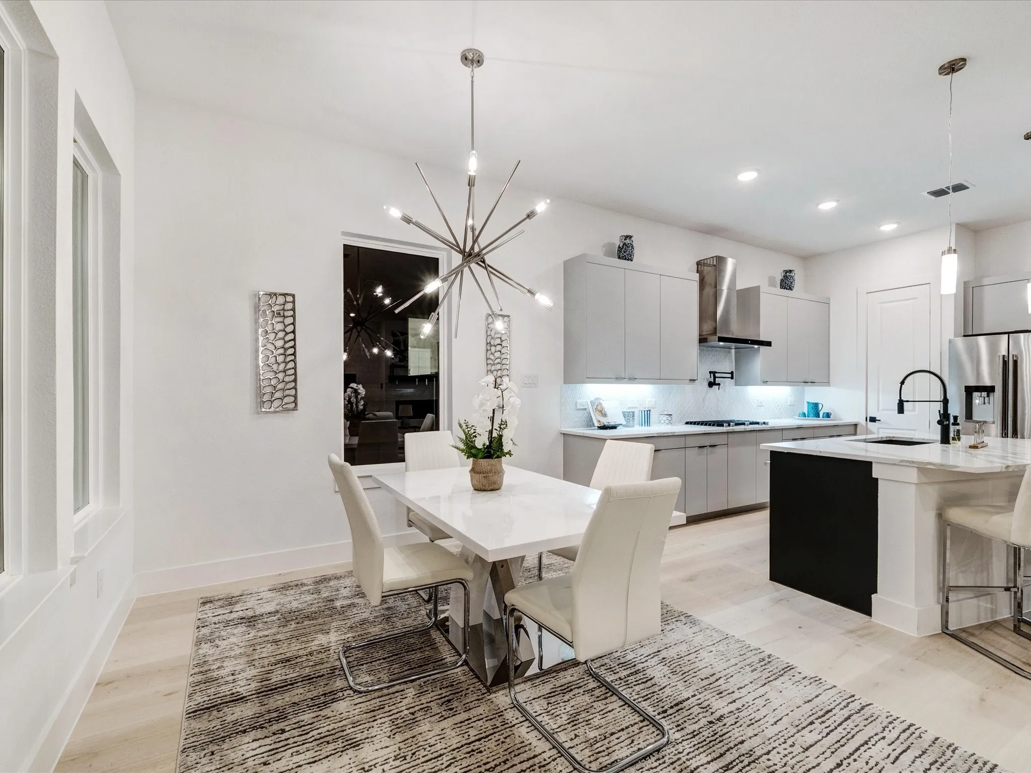 Dining room featuring light wood finished floors, a chandelier, and recessed lighting