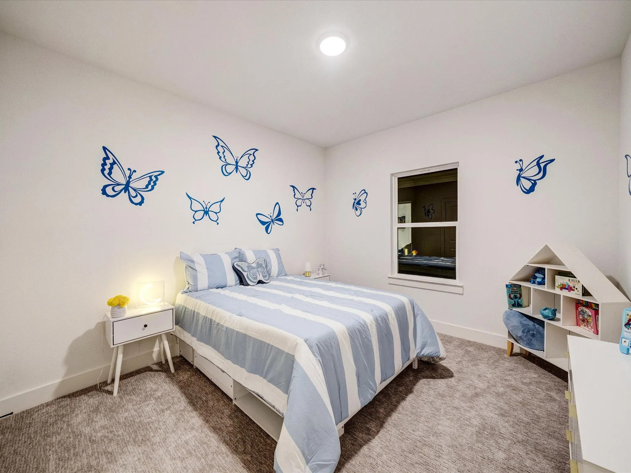 Bedroom with light colored carpet