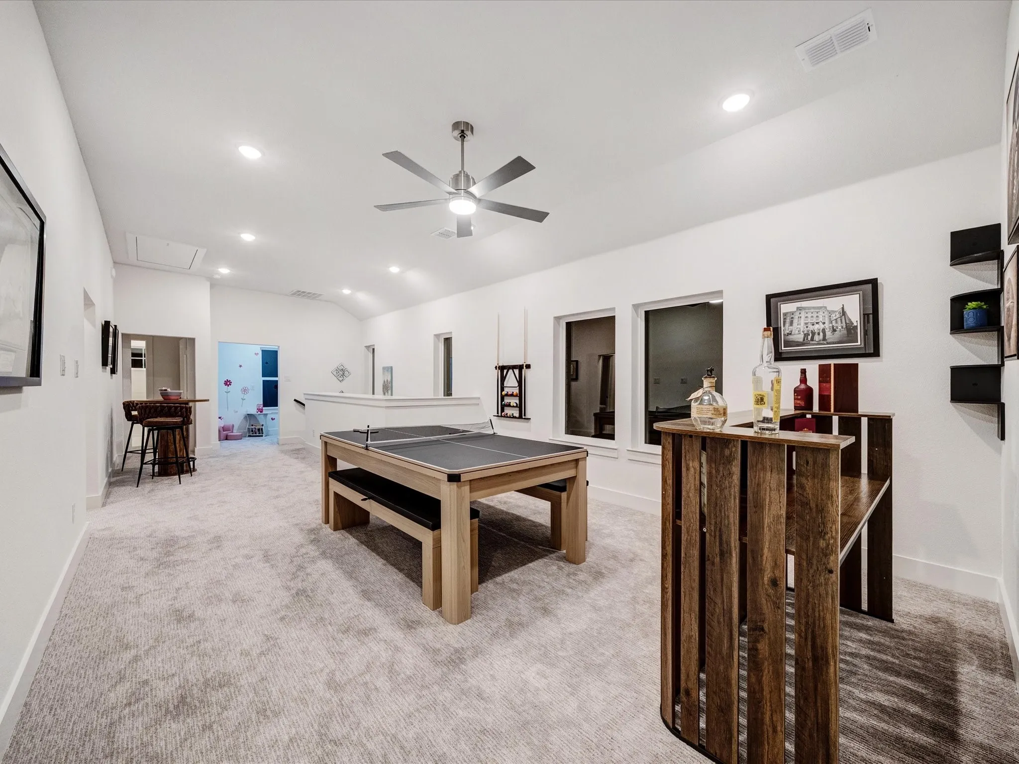 Rec room with light carpet, lofted ceiling, a ceiling fan, and recessed lighting
