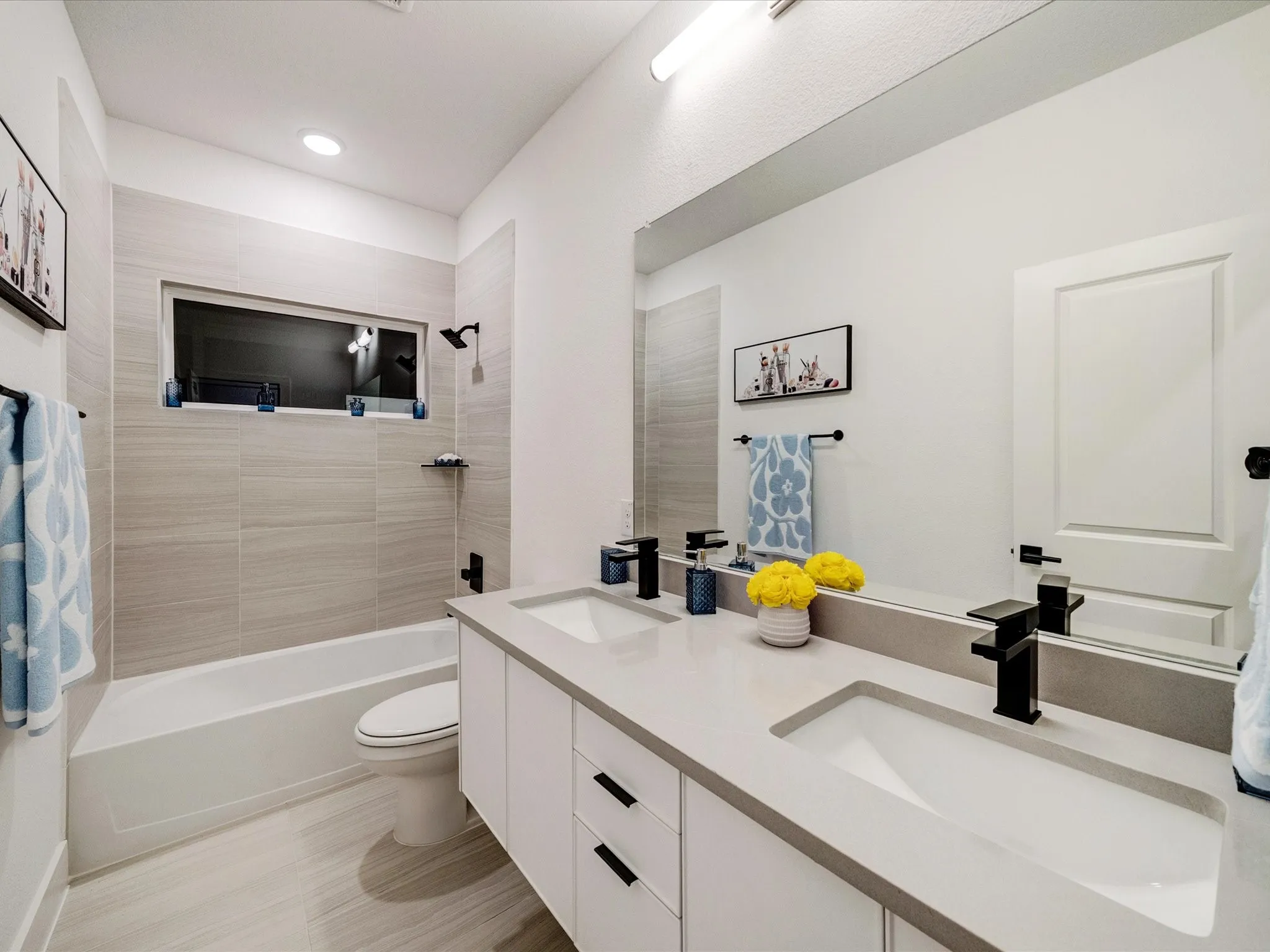 Full bath featuring bathtub / shower combination and double vanity
