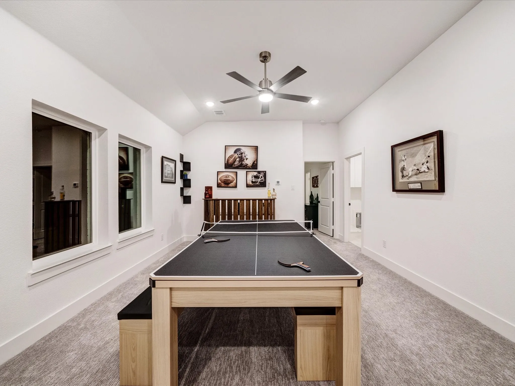 Playroom featuring light colored carpet, vaulted ceiling, a ceiling fan, and recessed lighting