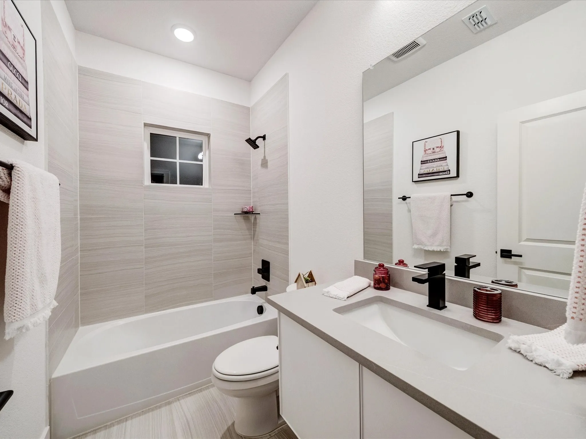 Full bath featuring shower / tub combination and vanity