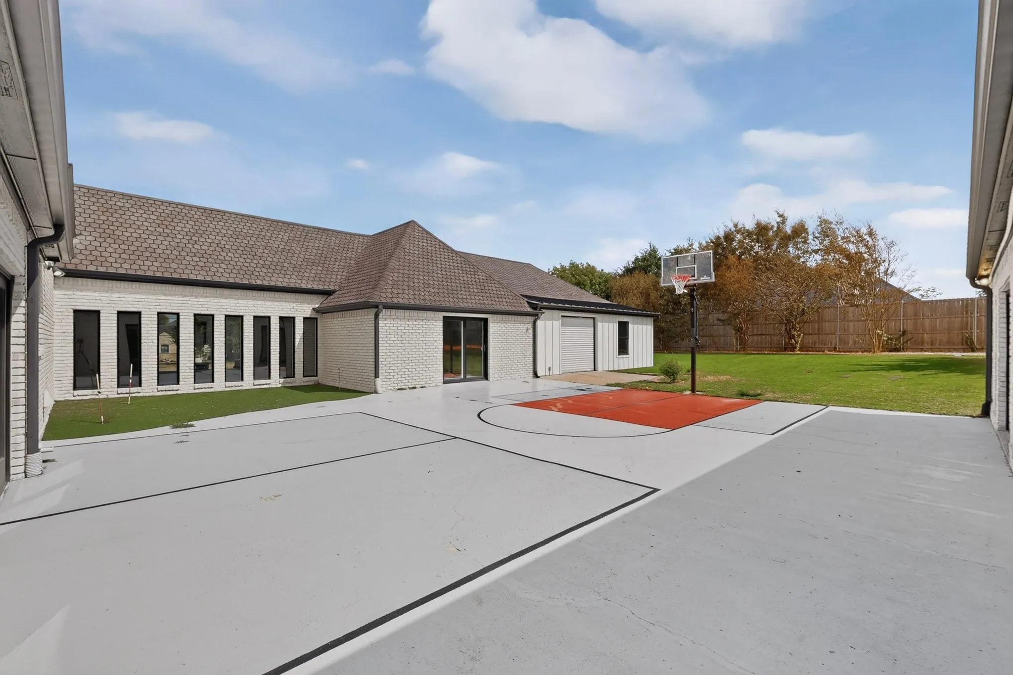 Expansive outdoor court with painted basketball key