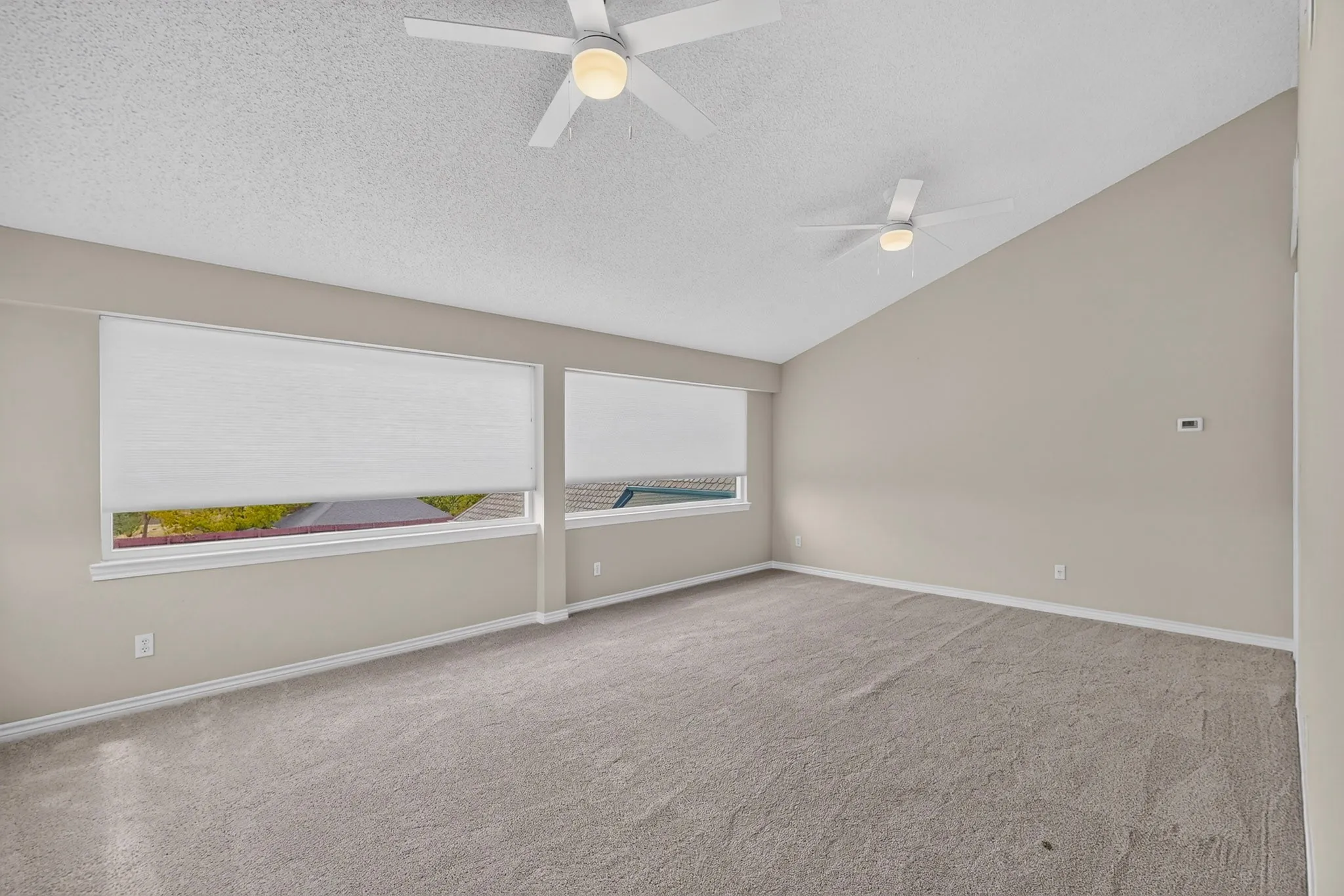 Vaulted ceiling with dual ceiling fans