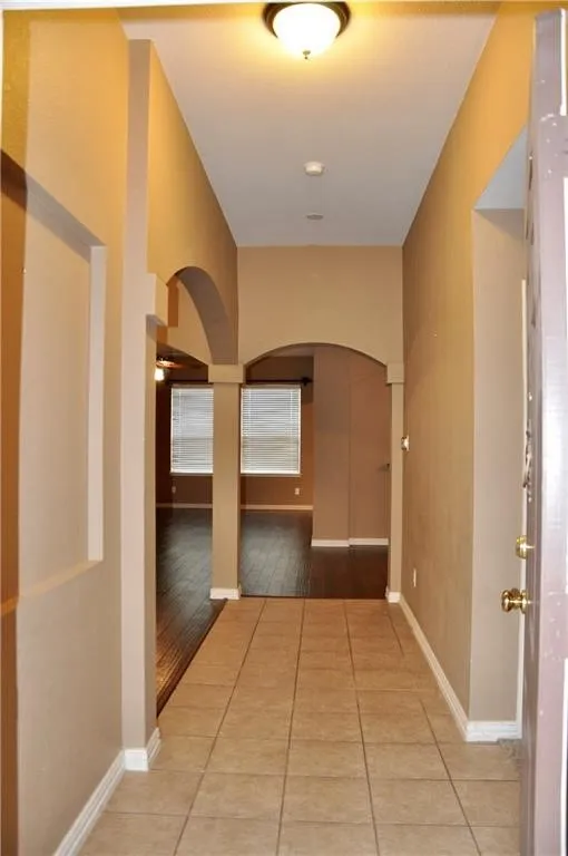 Front Entryway with arched doorways, recessed lighting.