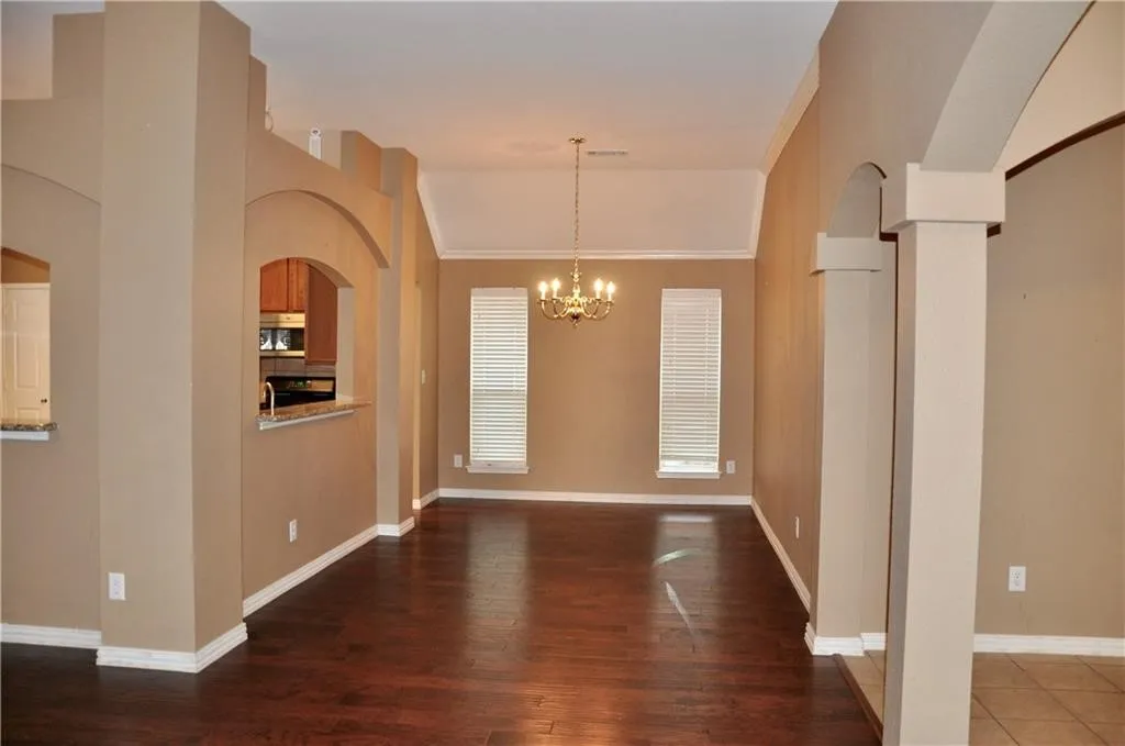 Expansive open floor plan with high ceilings, perfect for entertaining or flexible furniture layouts
