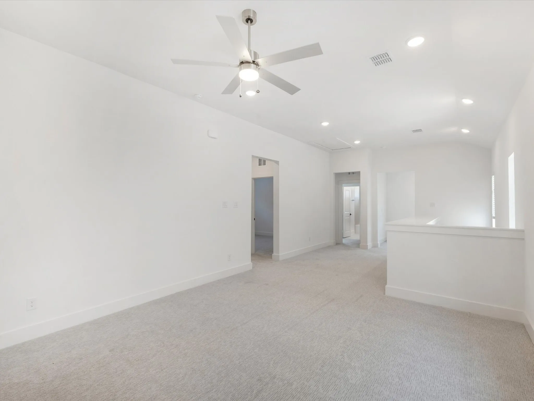 Game room featuring light carpet, recessed lighting, attic access, and a ceiling fan