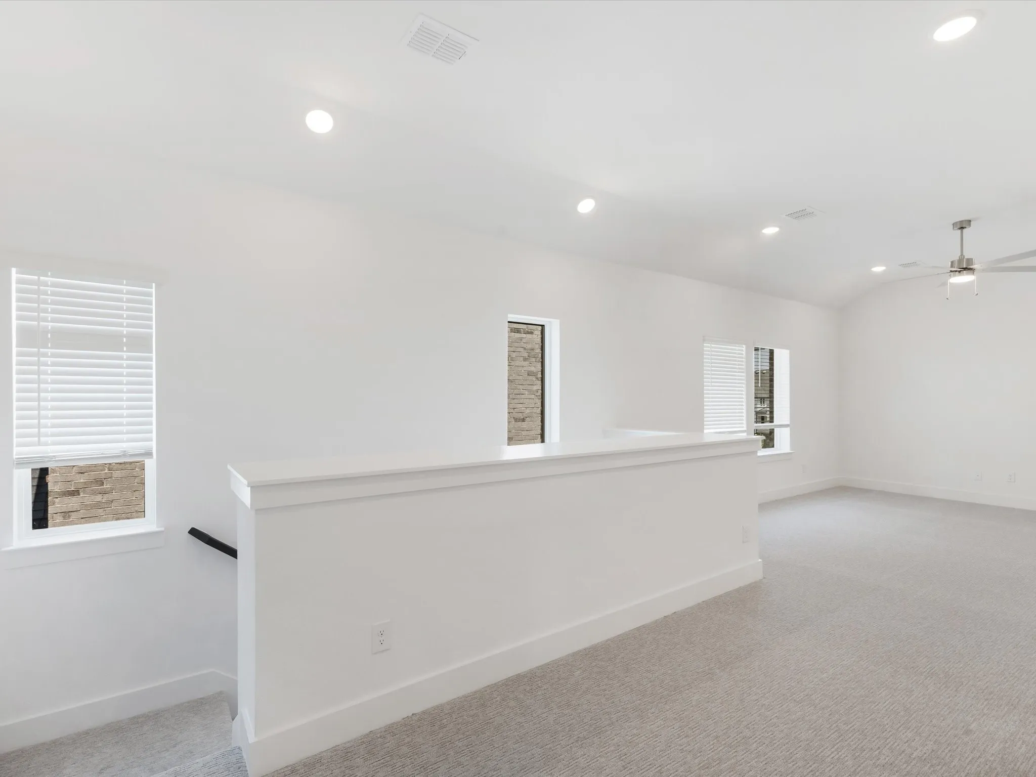 Game room featuring light colored carpet, recessed lighting, a ceiling fan, and lofted ceiling