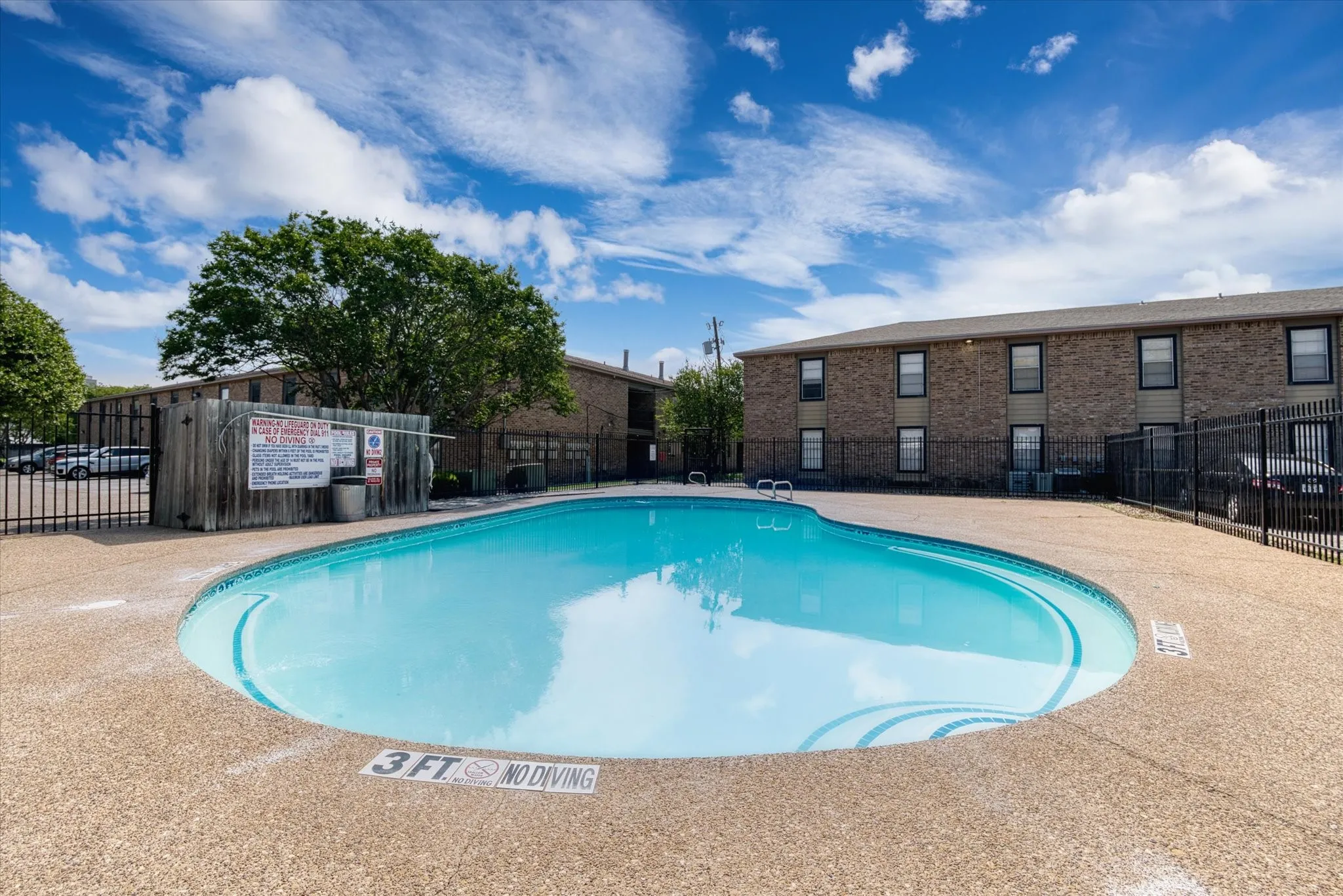 Swimming pool with a textured concrete deck