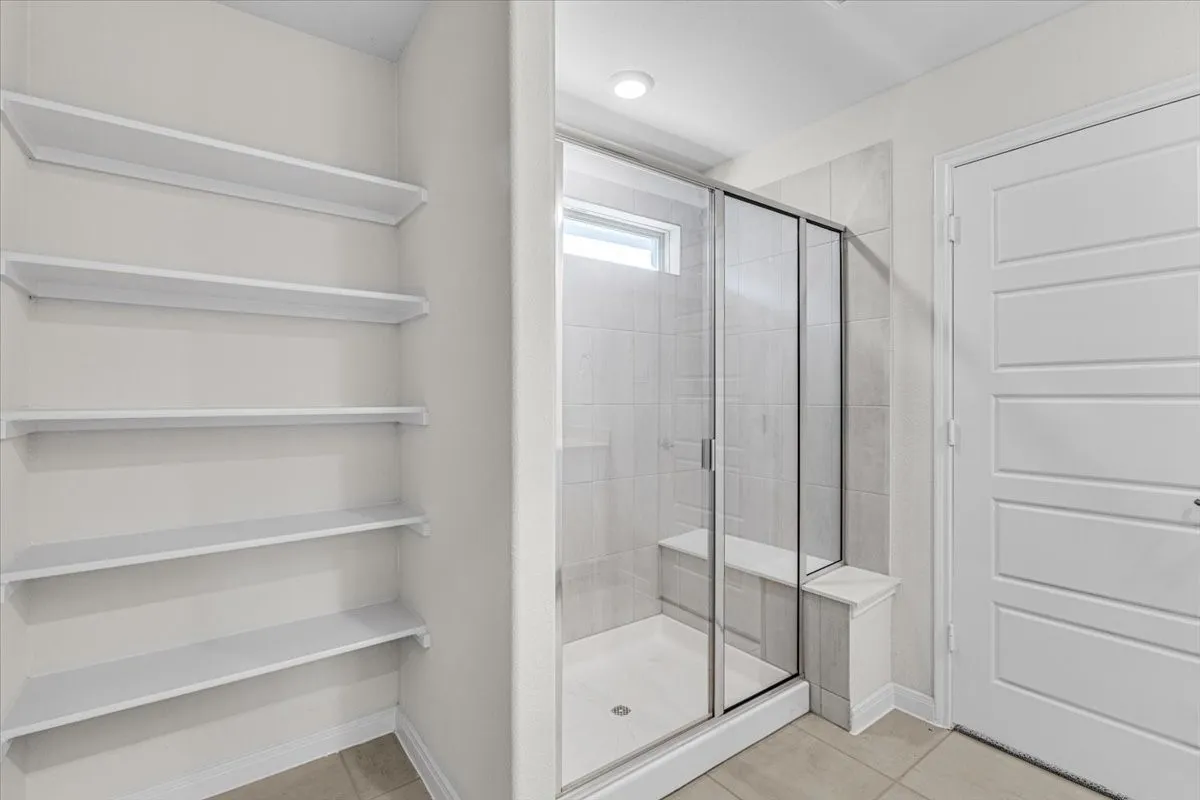 Another view of the elegant master bathroom