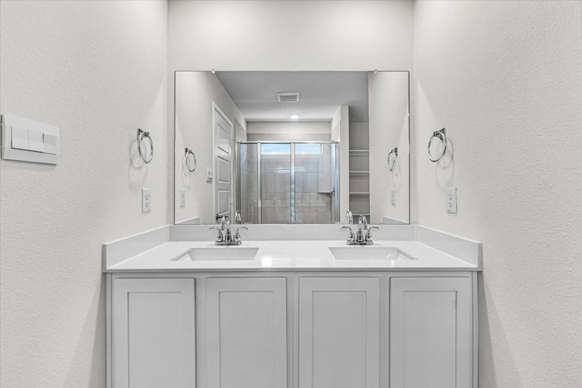 Another view of the elegant master bathroom