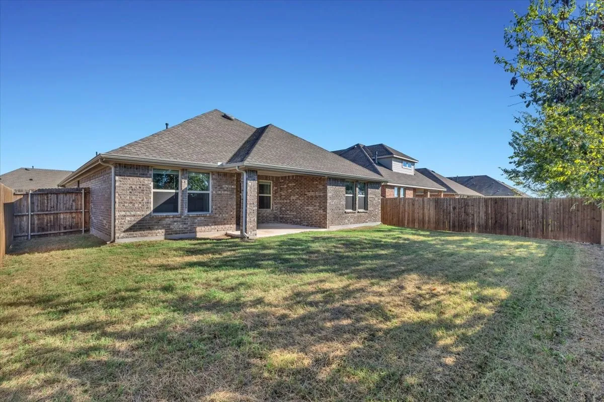 Large backyard with covered patio