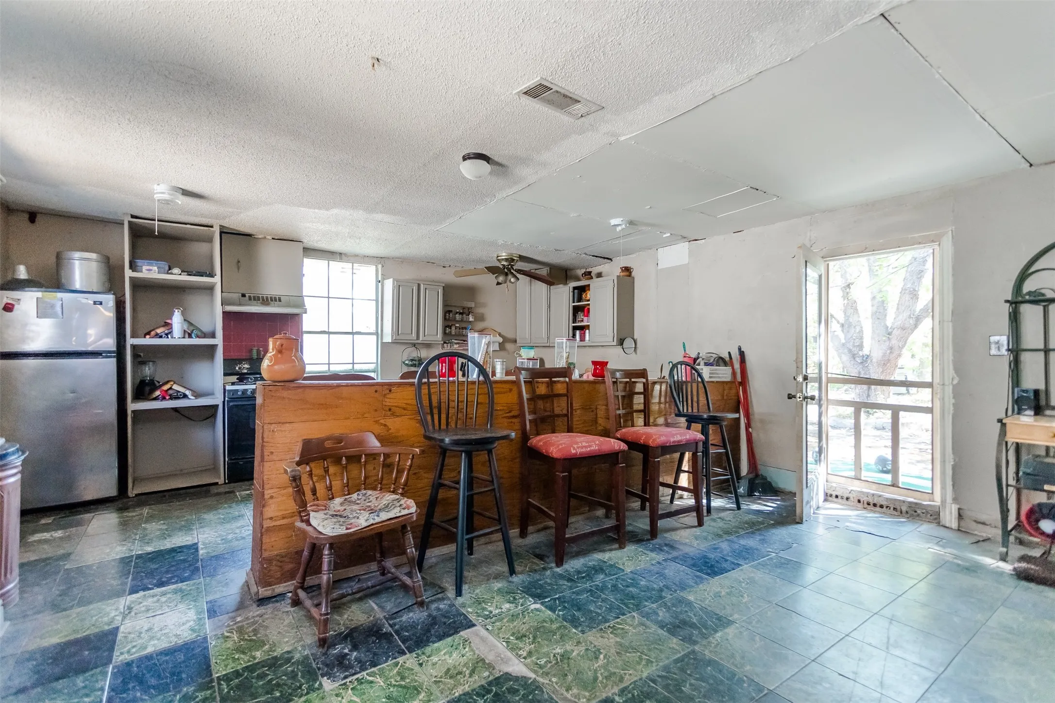 Kitchen Has Gas Stove (Propane), Cabinets, Sink & Refrigerator Space.