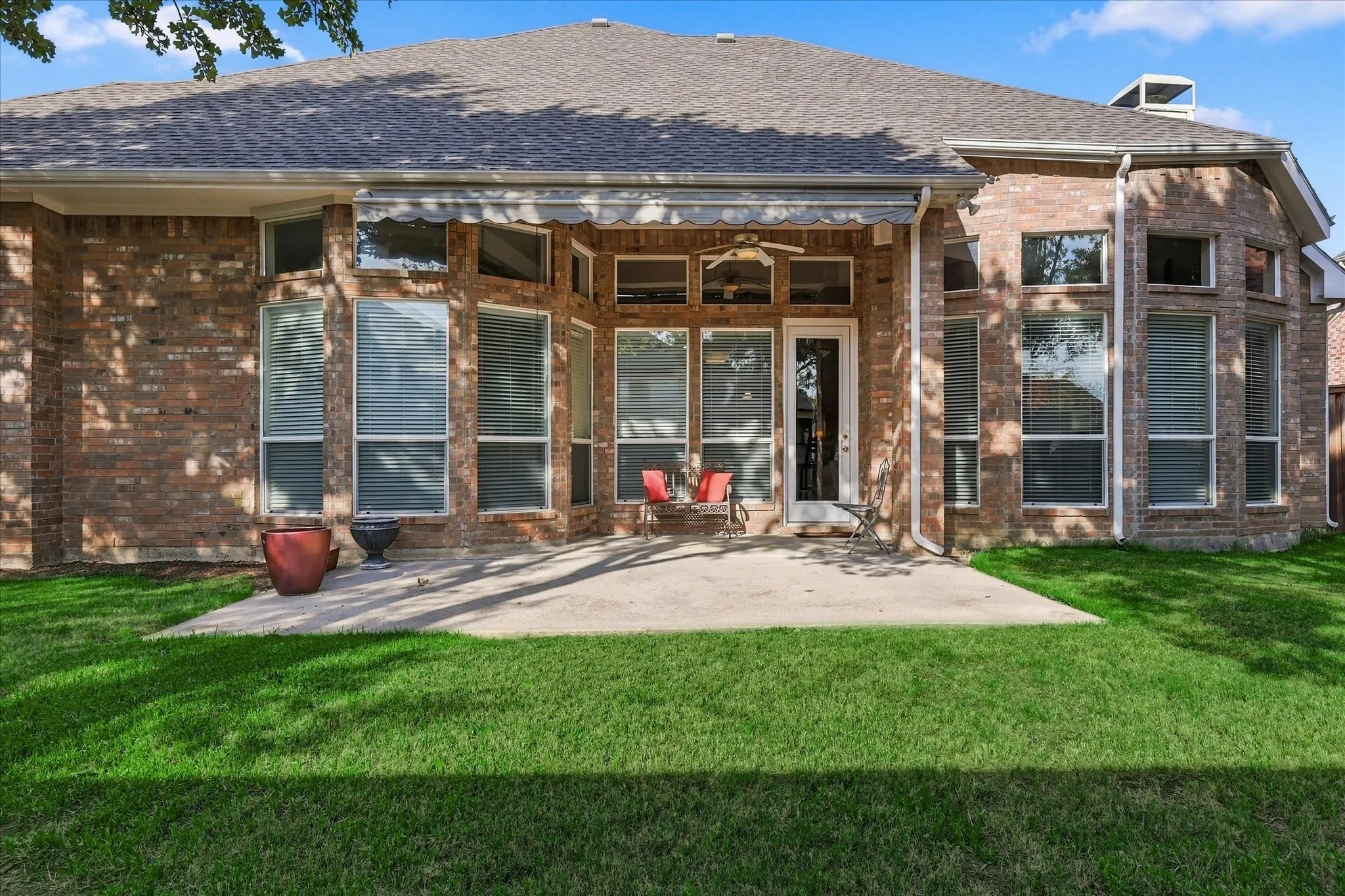 Brick exterior with a shingled roof