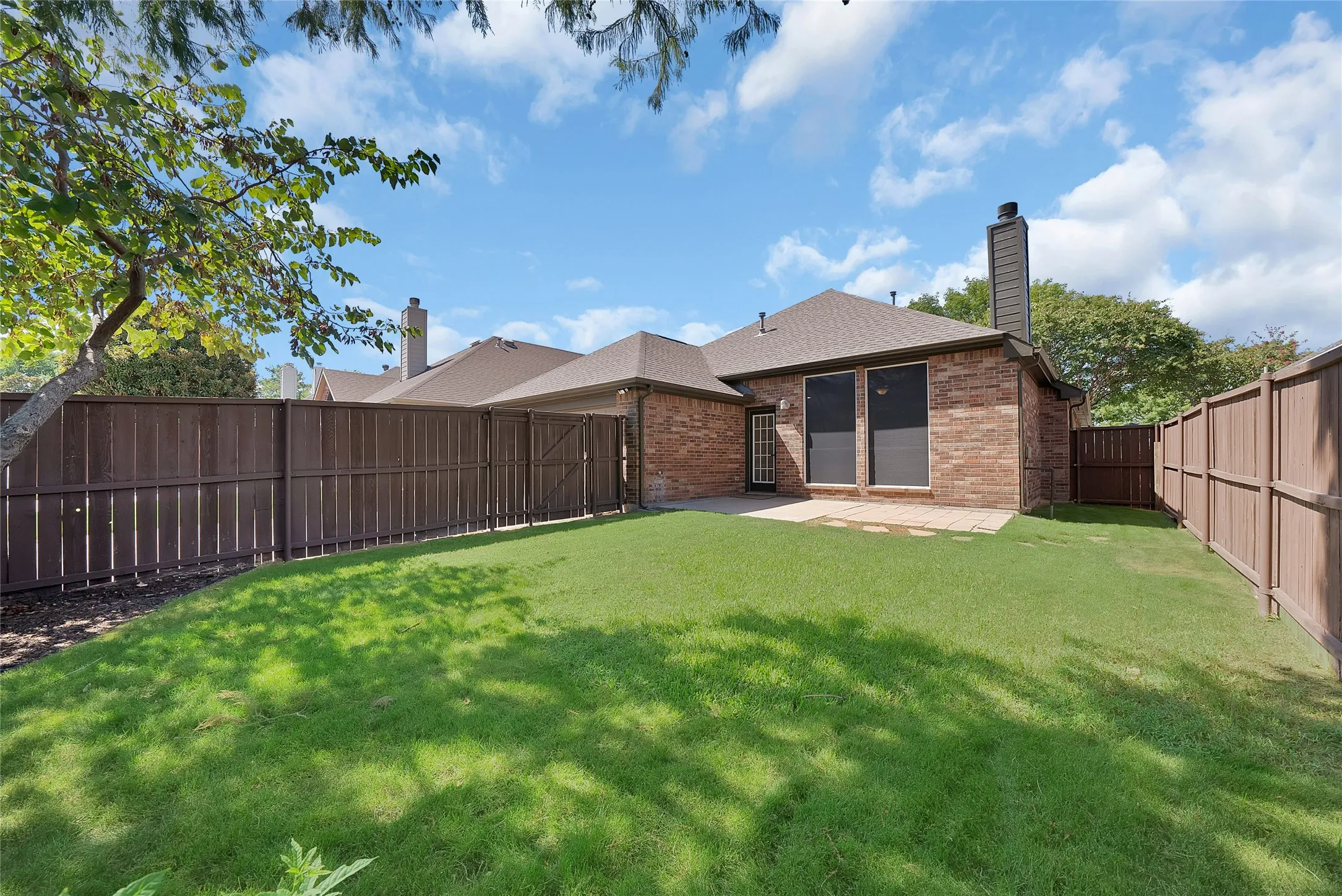 Great backyard with mature shade trees and plenty of room for kids and pets. Fence has been restained.