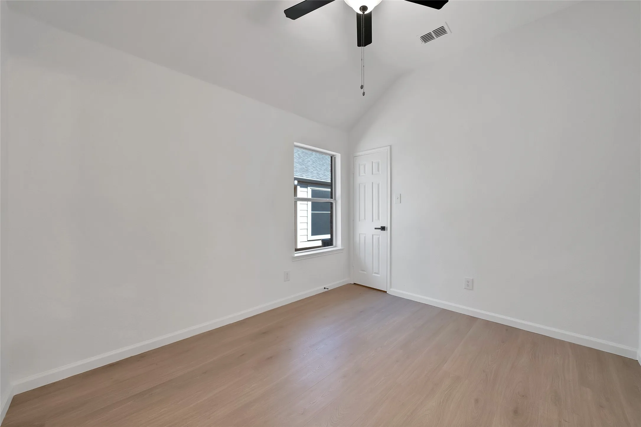 Another secondary bedroom with a large walk-in closet.