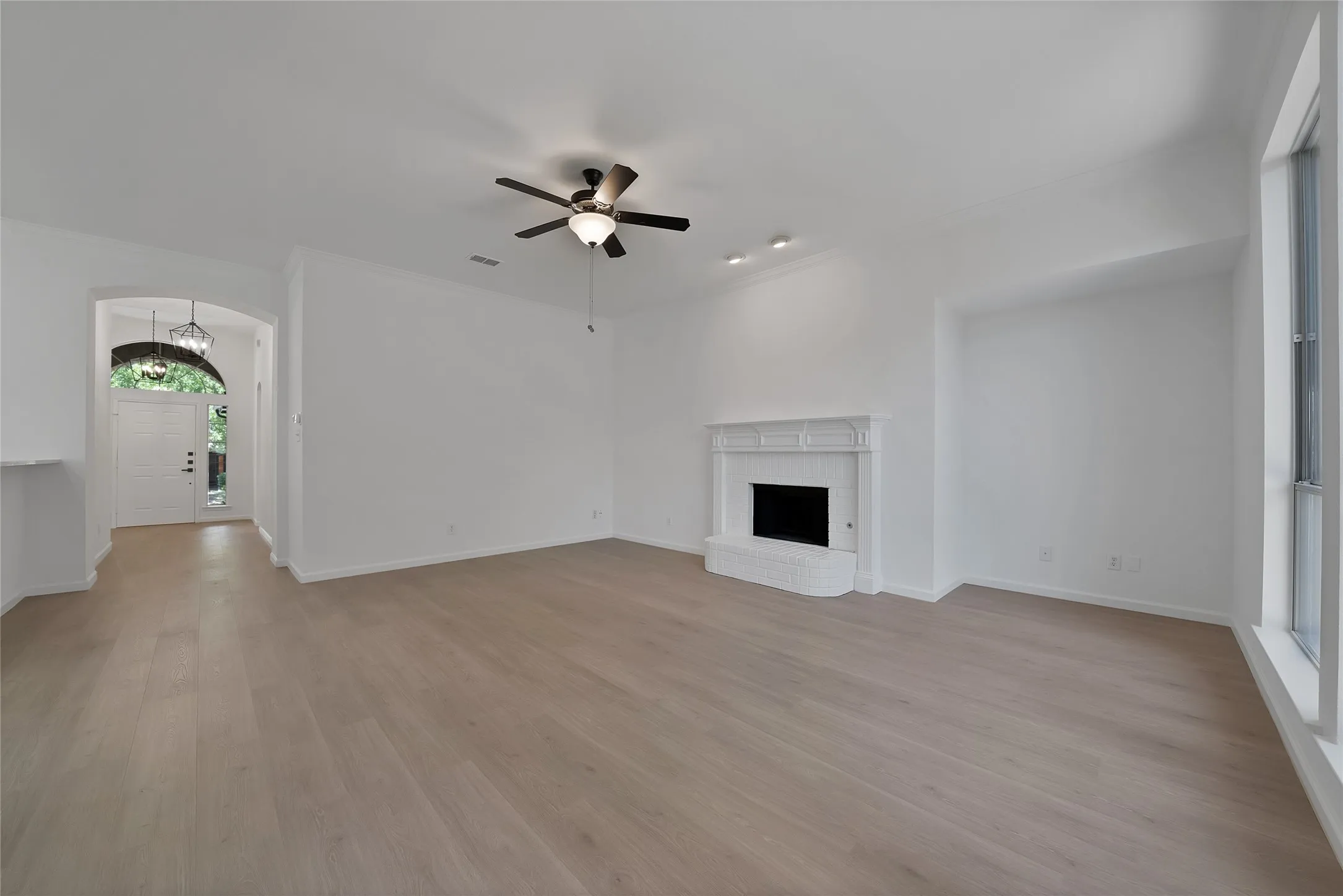 View looking back to the entry. So much space! All lighting and ceiling fans have been replaced.