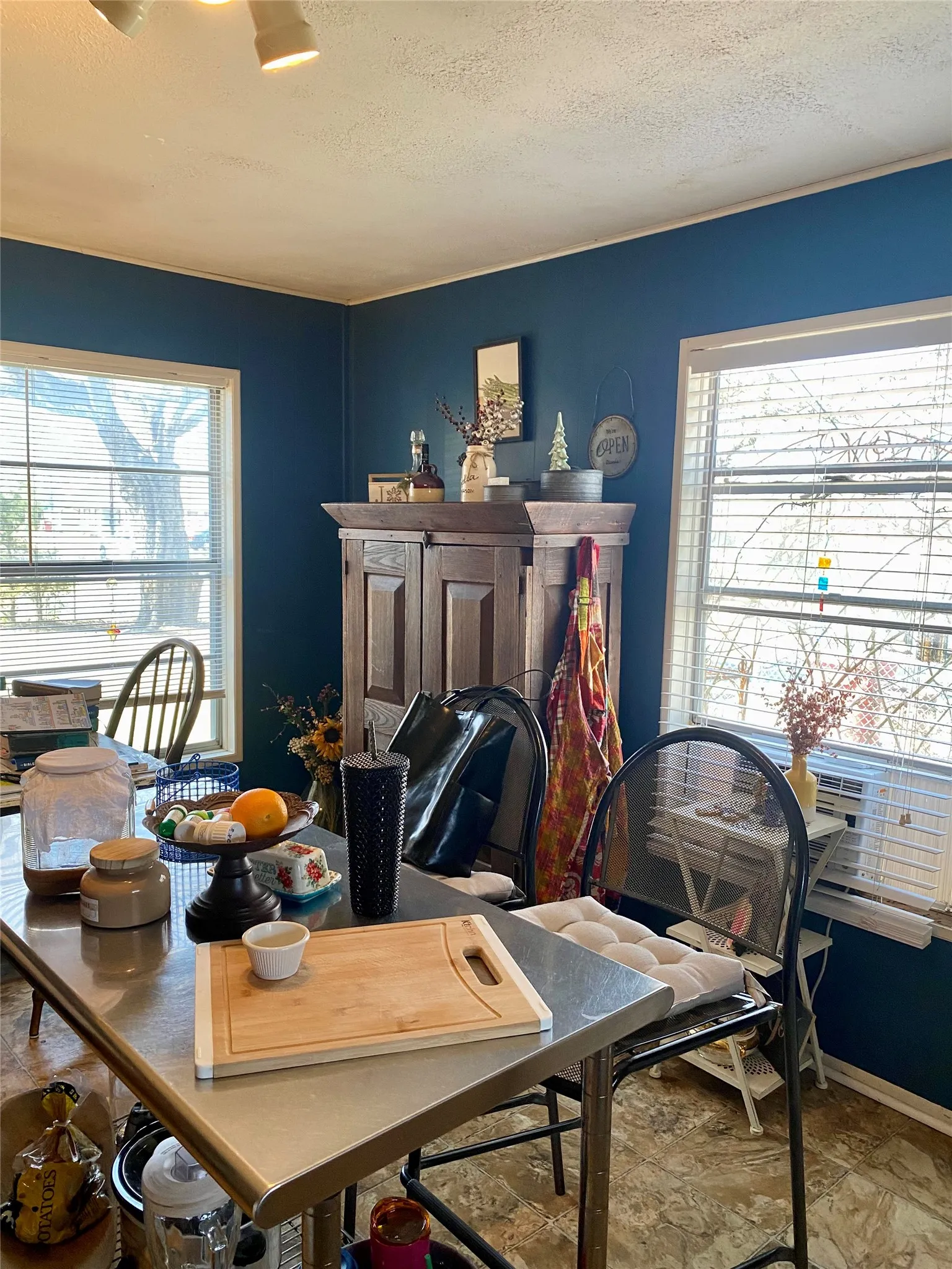 Eat in Kitchen with a healthy amount of sunlight and a textured ceiling