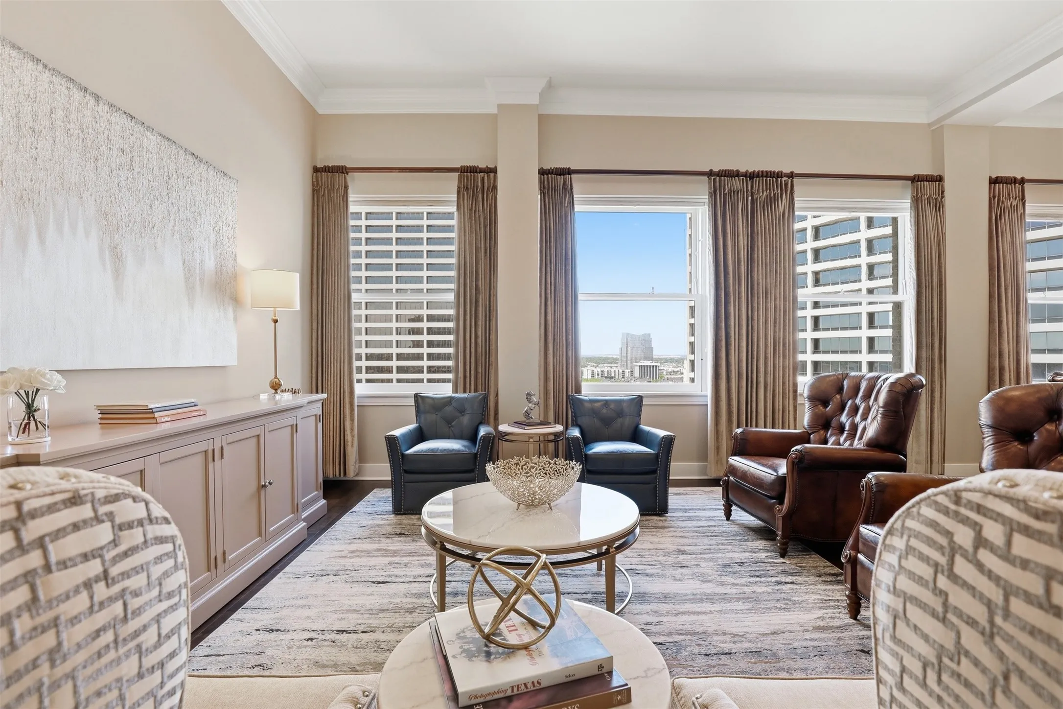 High ceilings, wood-finish flooring, built-in cabinetry, and multiple windows with city exposure