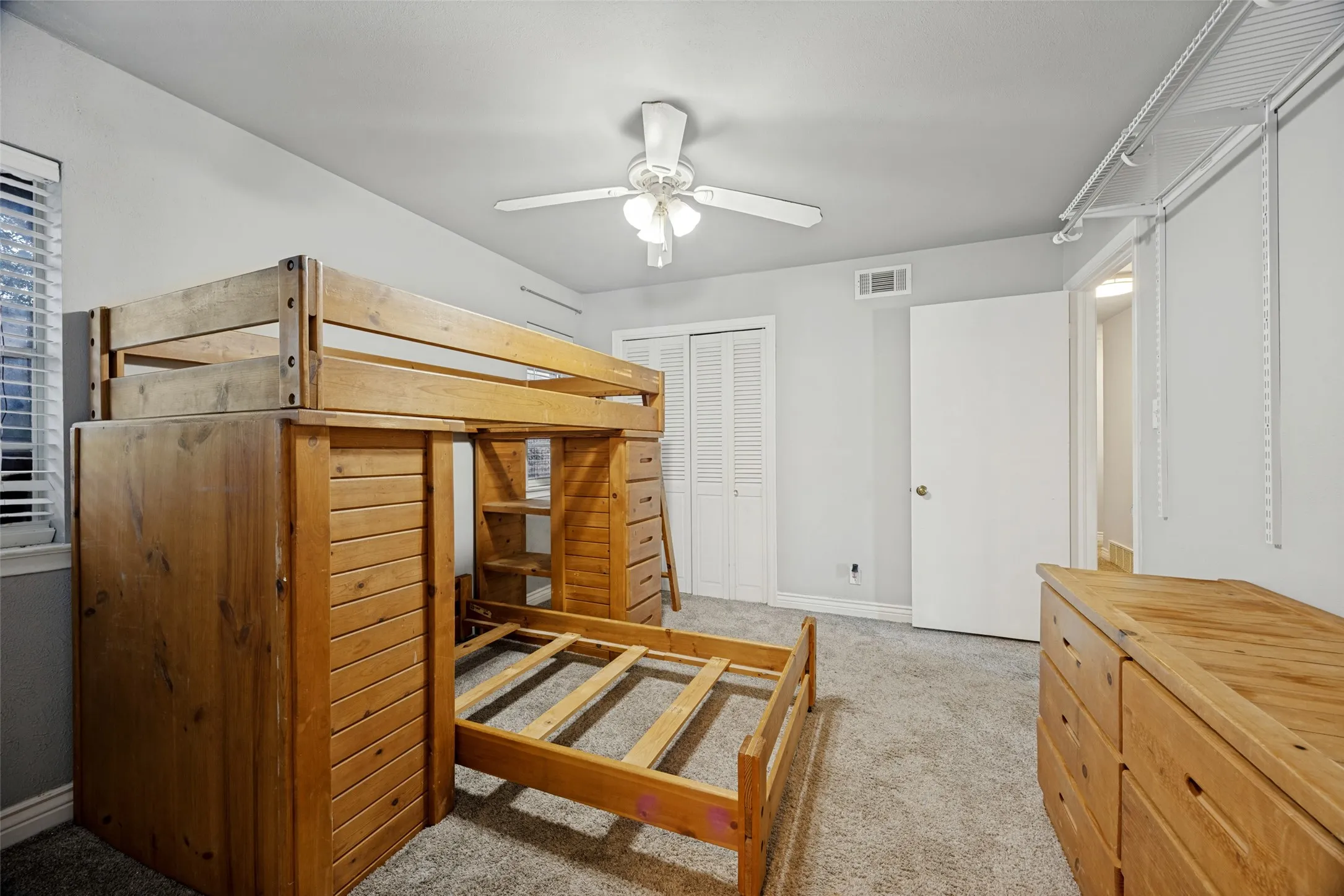 Wall-to-wall carpeting and white walls