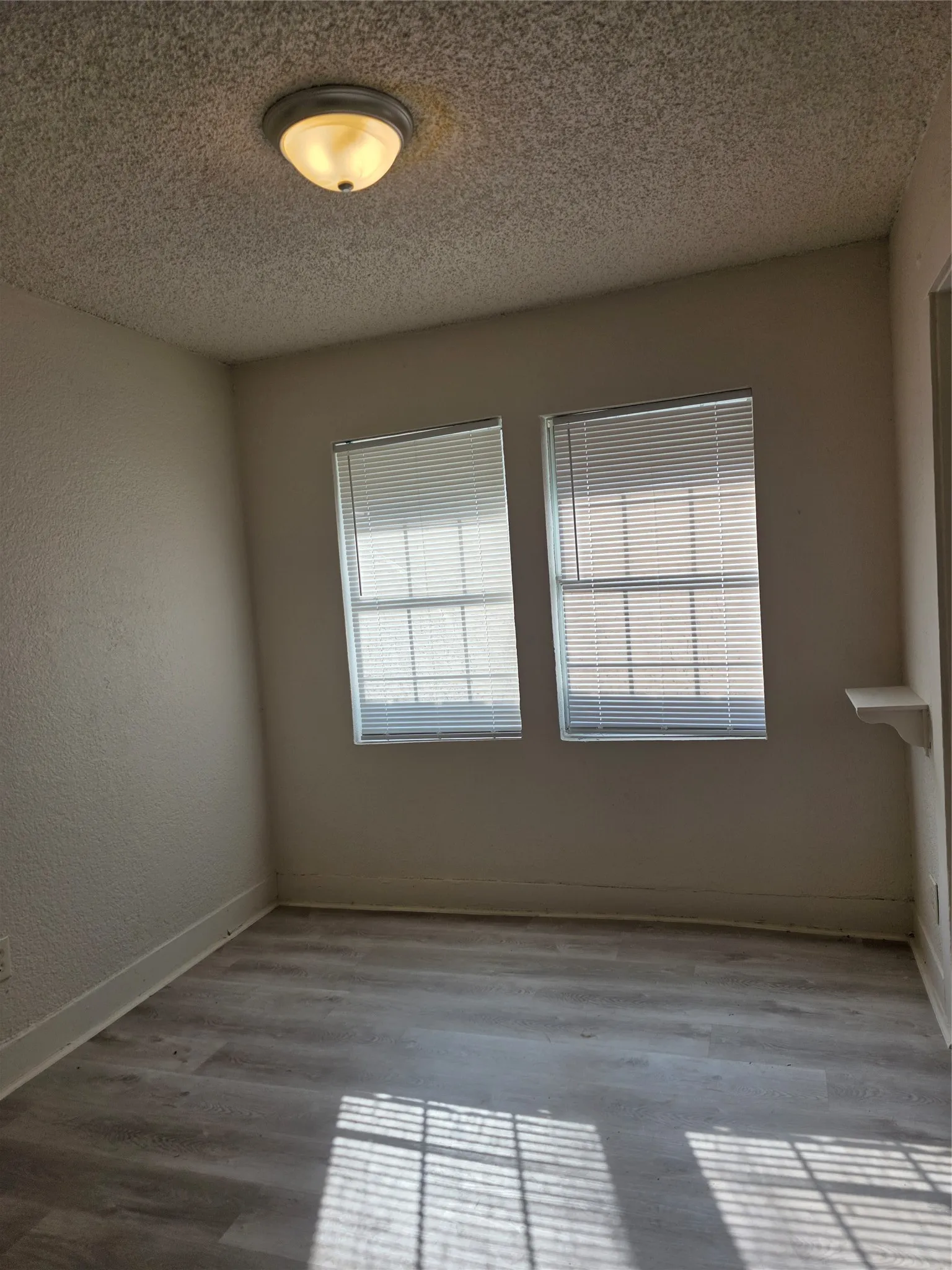 Wood-finish flooring with baseboard trim